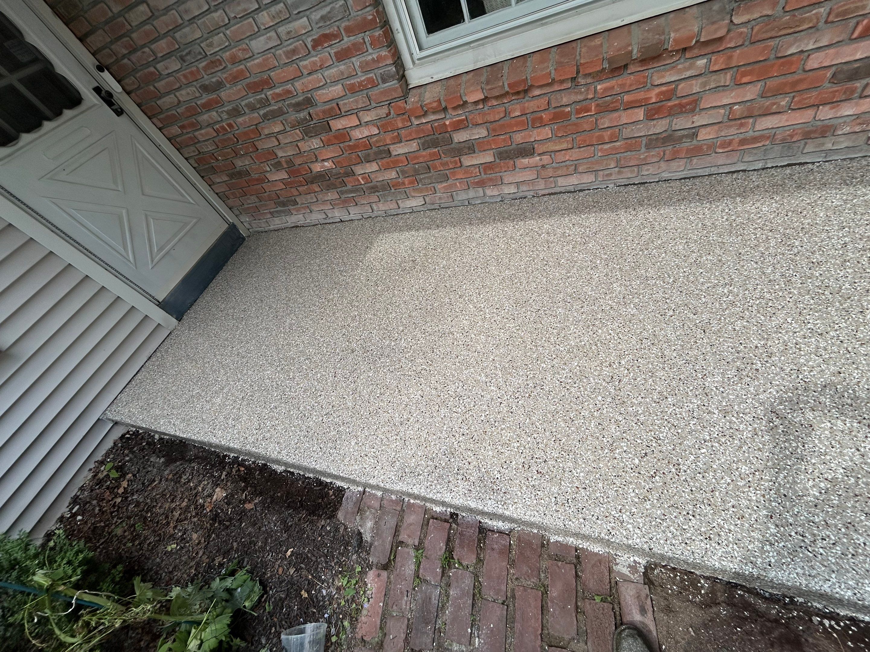 Concrete Floor Coating Transformation by DiGiorgi Roofing and Siding Inc