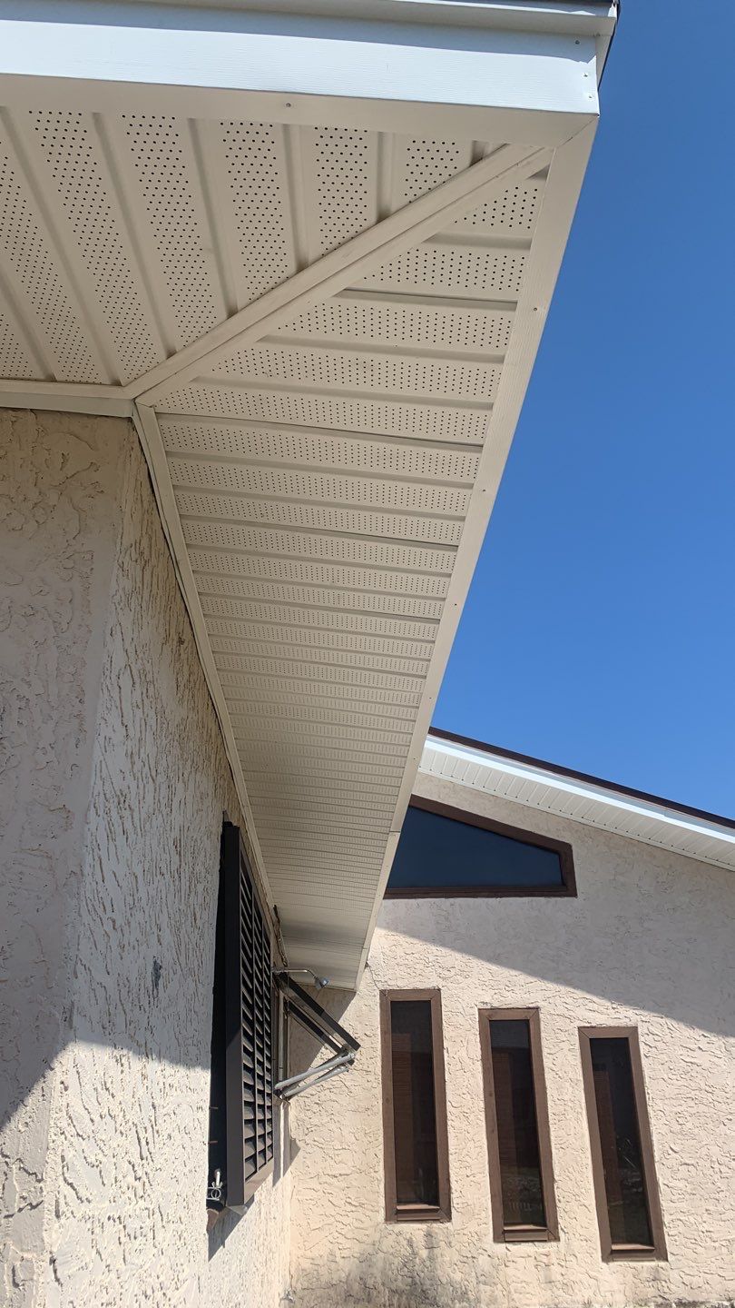 Soffit and Fascia Installation Using White Vinyl Soffit and Musket Brown Fascia by Gutter Professors