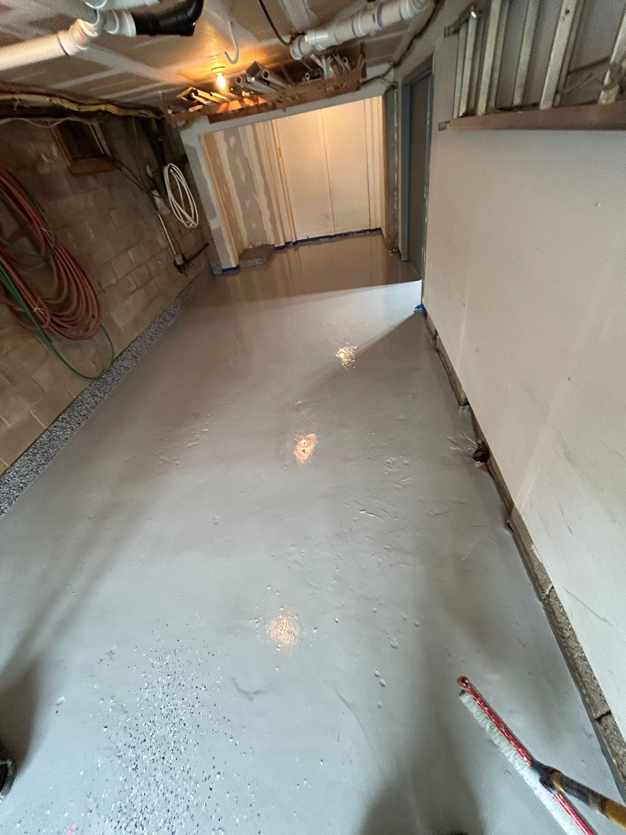 Garage Concrete Floor Coating Transformation by DiGiorgi Roofing and Siding Inc