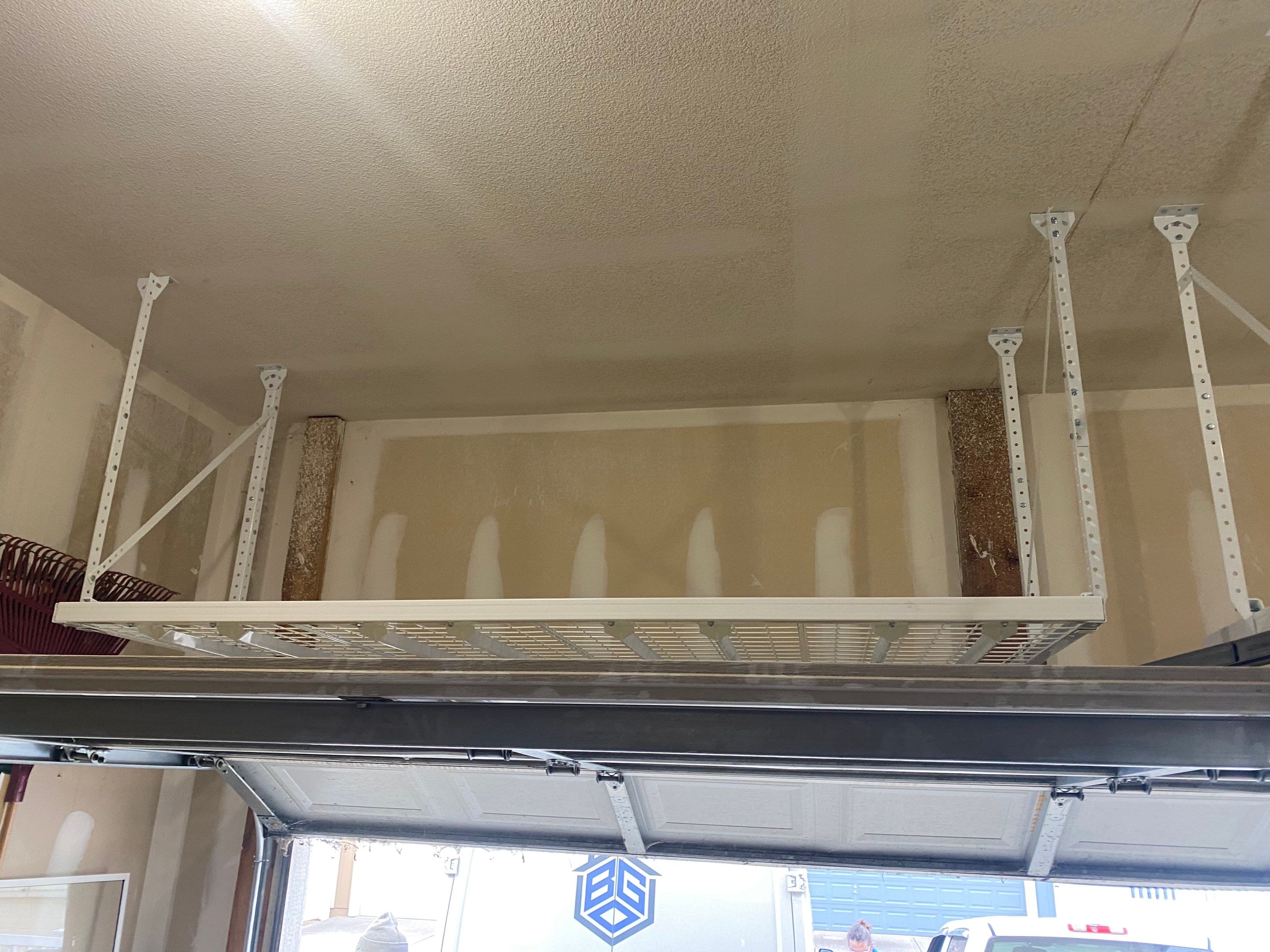 John B. adds ceiling rack to garage! by Banner Garage