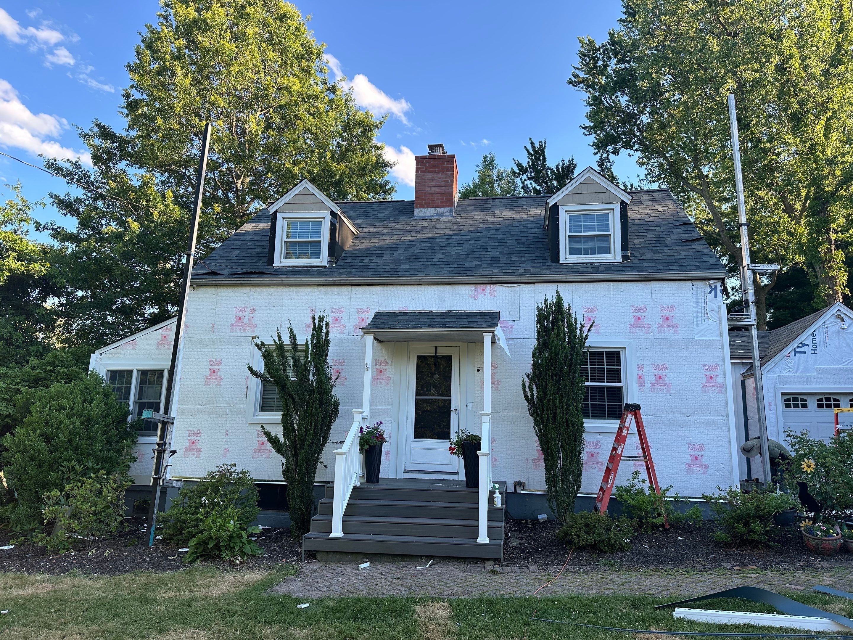 Complete Exterior Estate gray with Pacific Blue Siding by A Plus Exterior