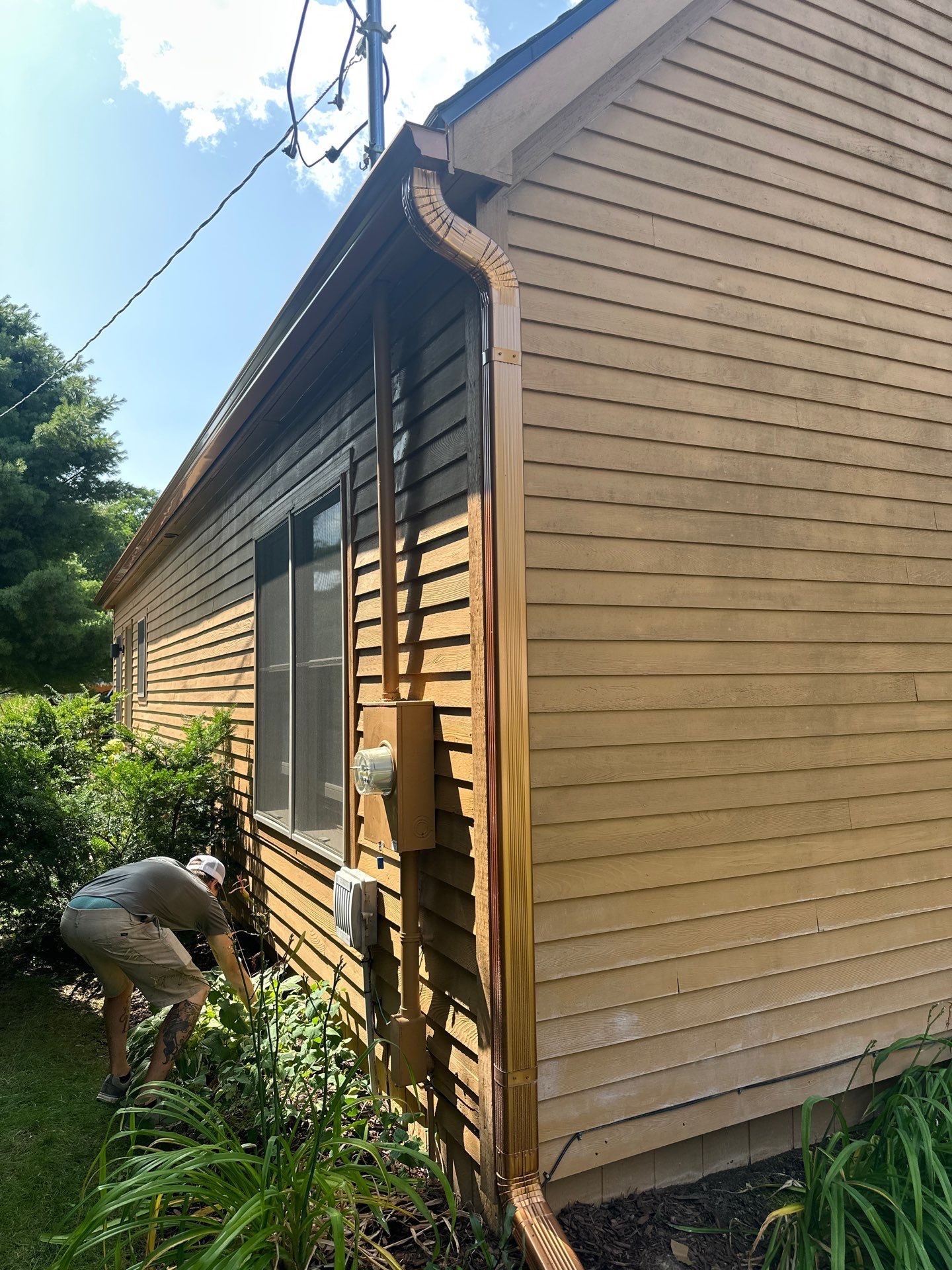 Coppertone Gutter Downspout in Gaylord by Rainbow Seamless Systems