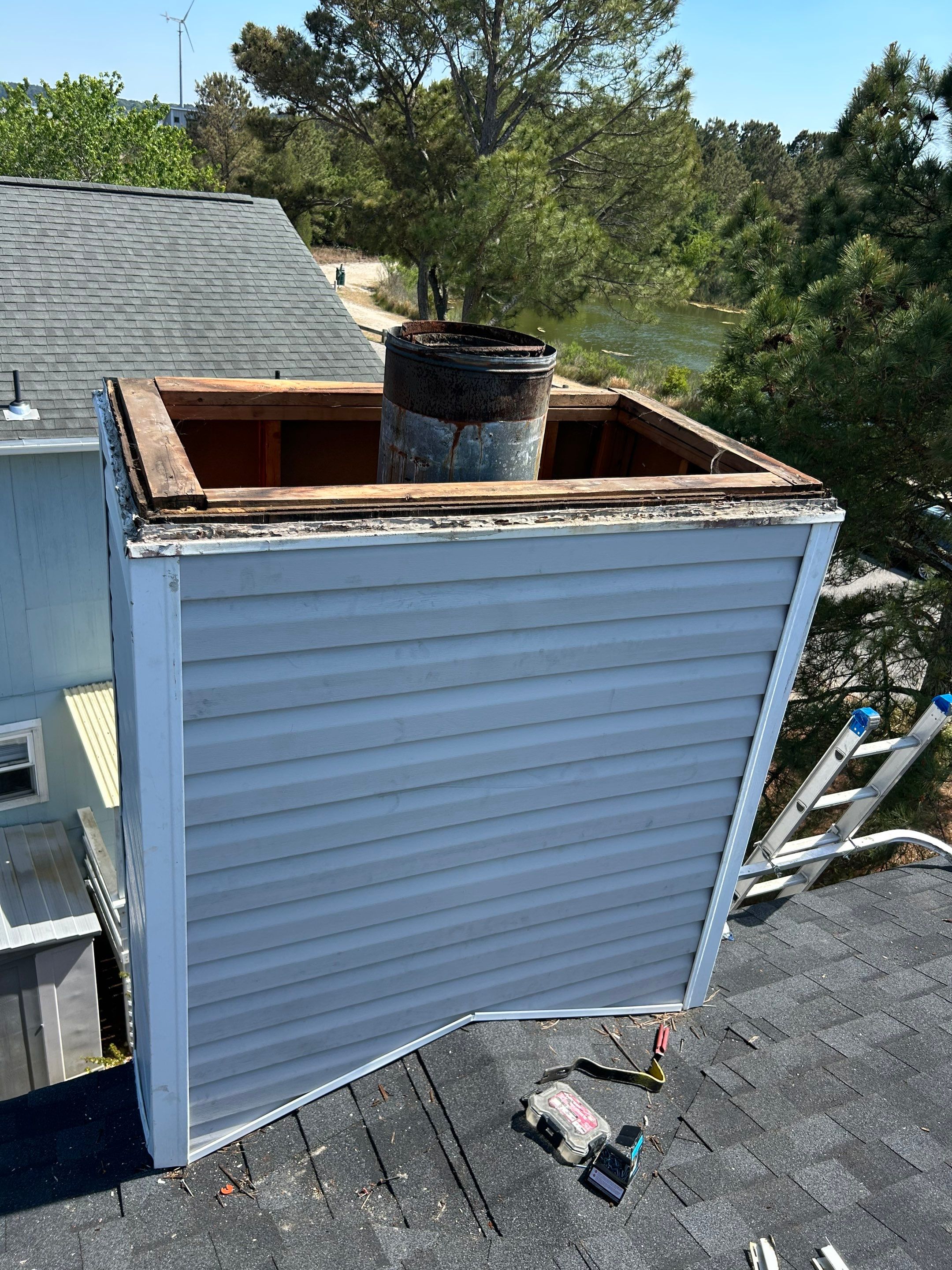 Chimney Leak Repair - Chase Cover, Cap, and Siding by Premier Chimney and Roofing