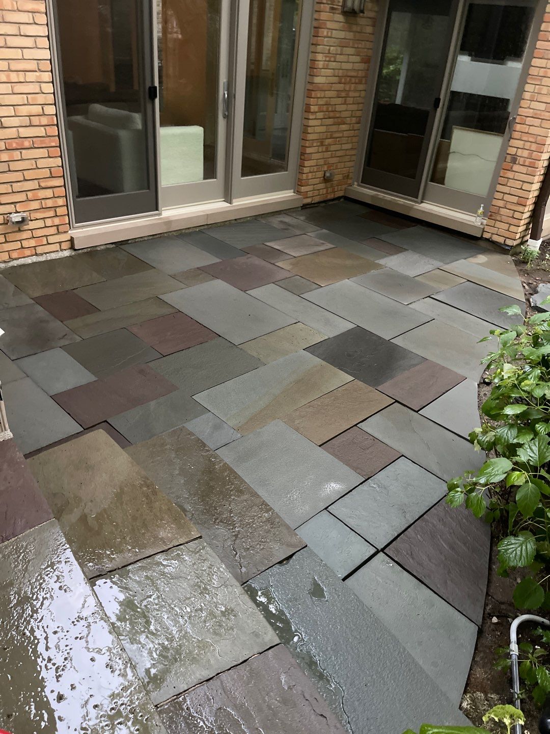 Bluestone patio cleaning by Northern Power Washing LLC.