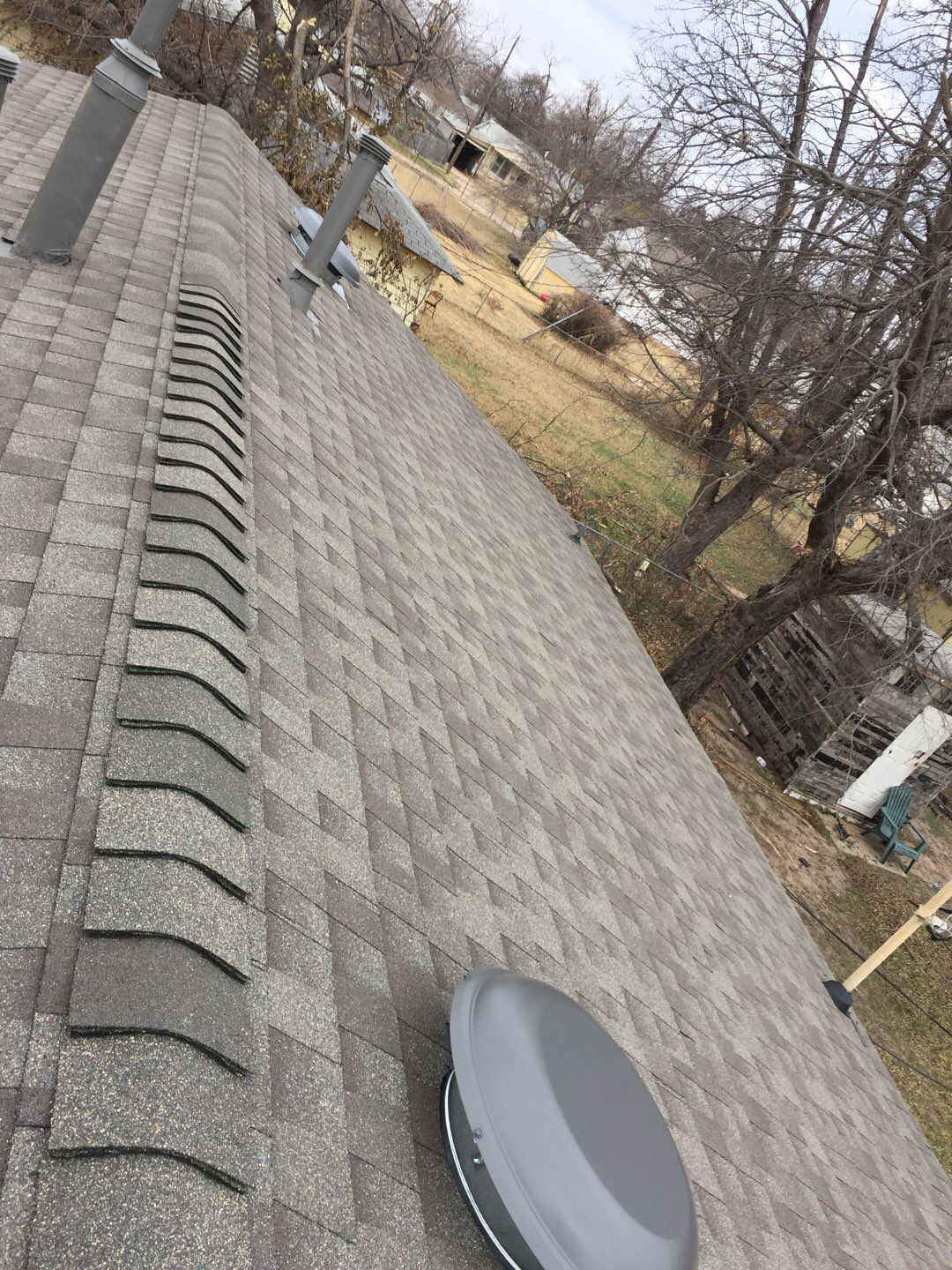 vent stack & solar tube in Warr Acres by McCann's Roofing and Construction