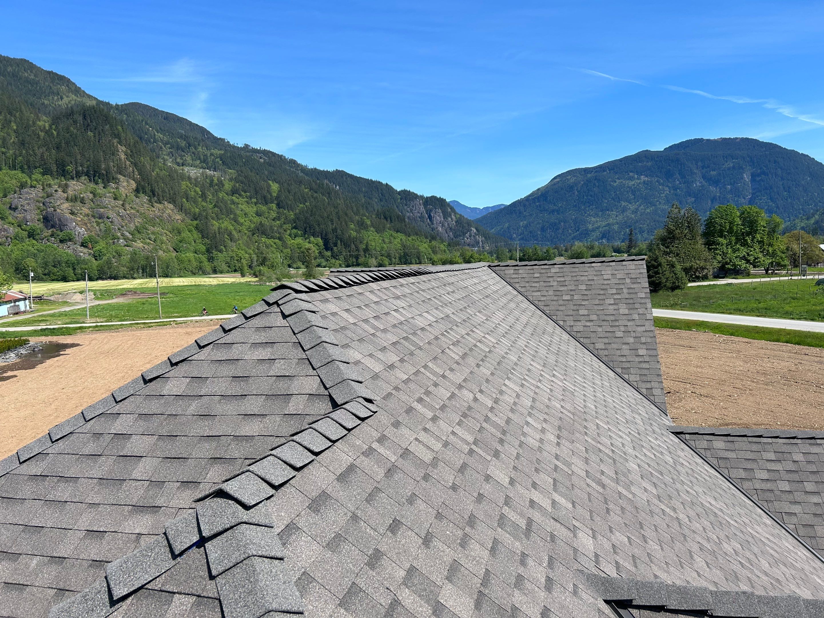Residential Roofing Installation upgraded venting and hip and ridge capping by Top Notch Roofing Inc