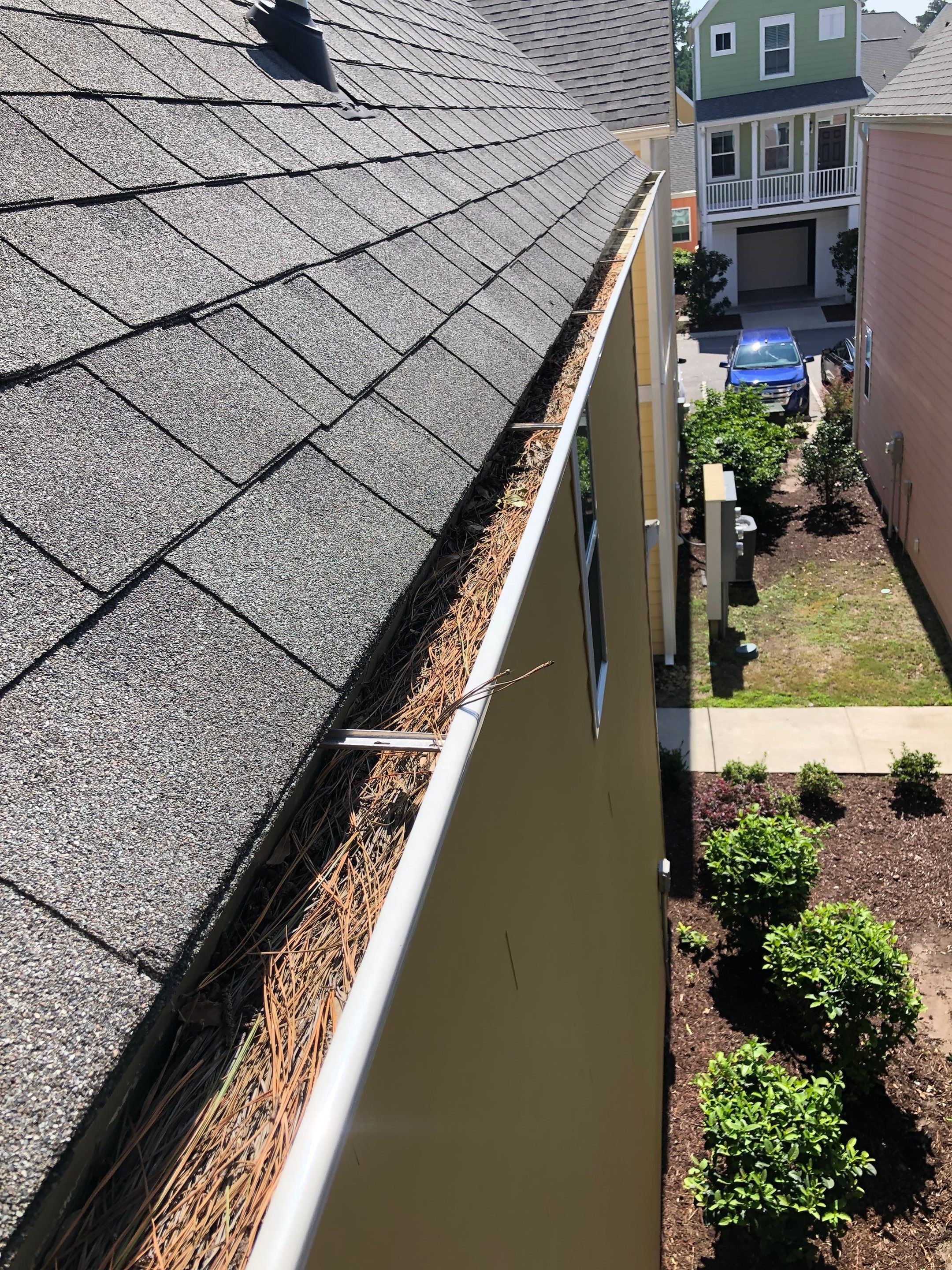 HOA gutter cleaning in Conway, SC,before photo showing full gutters.