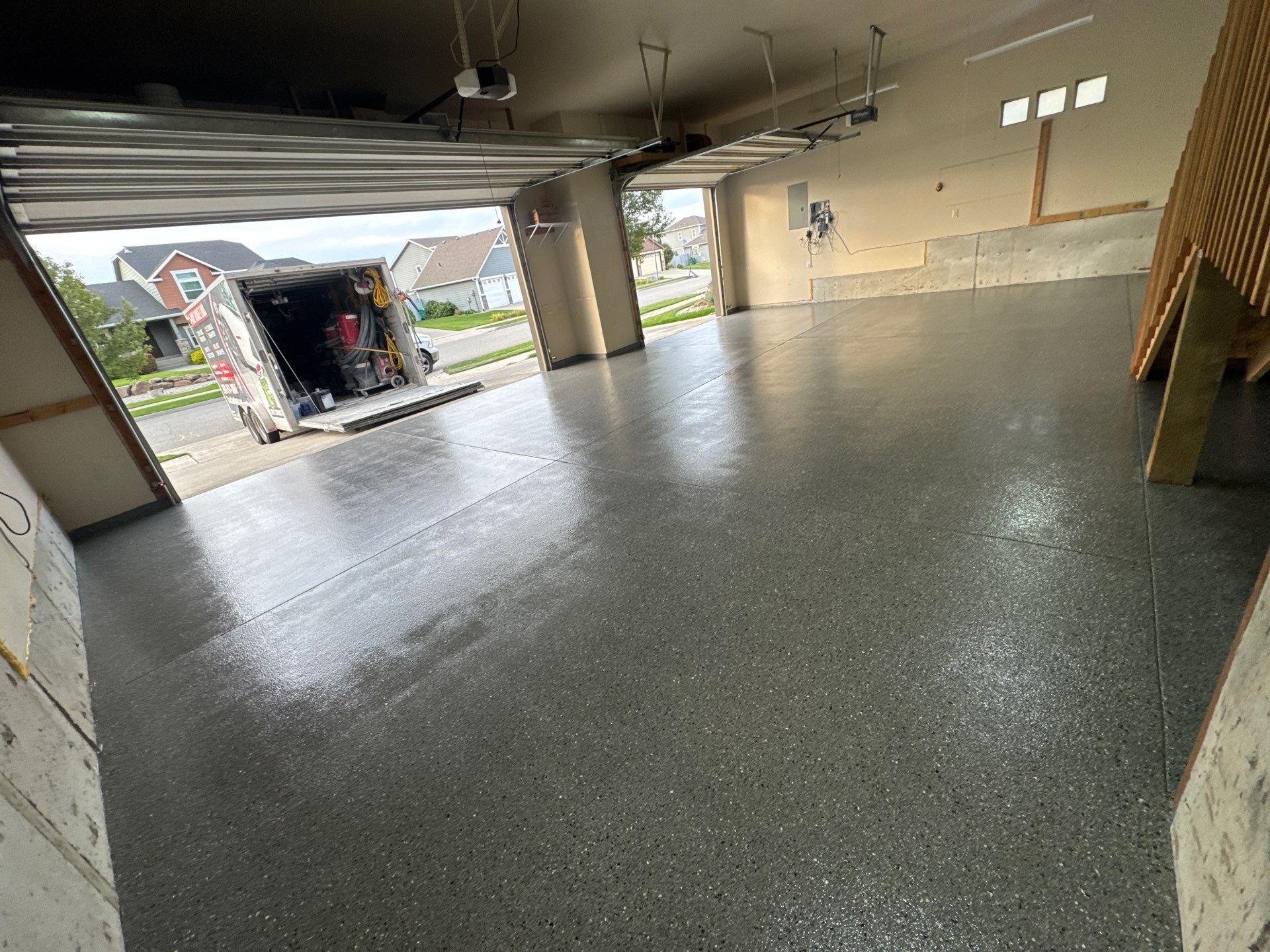 Custom Gray Speckled Polyaspartic Garage Floor Coating in Cheney by Croc Coatings, LLC