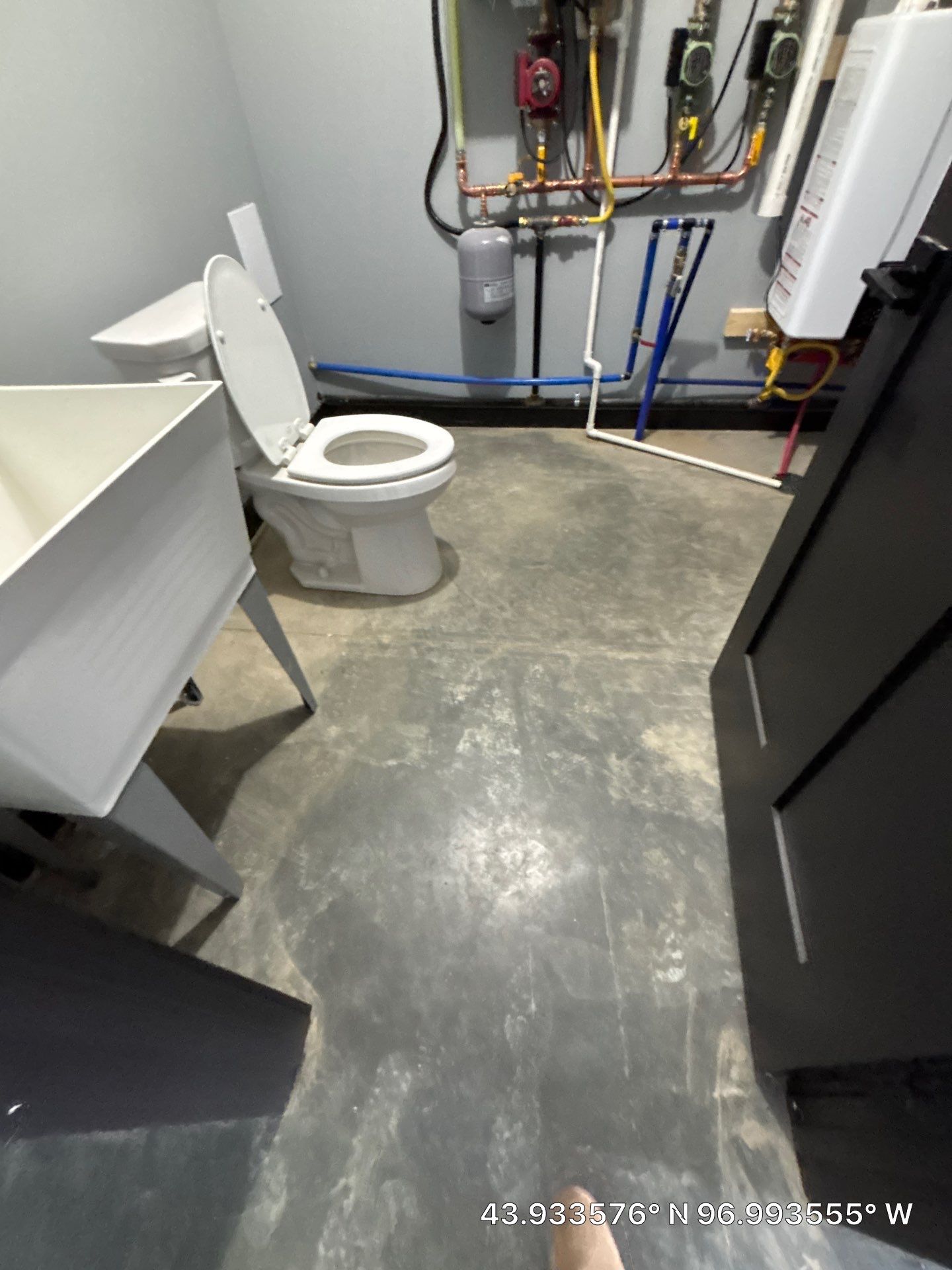 Polyaspartic Garage Floor Coating with Decorative Flake in Wentworth by Select Painting, Coatings & Garage Cabinets
