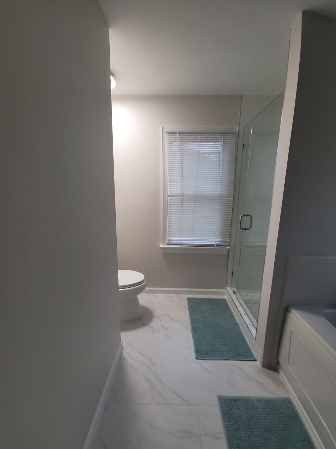 From Cramped & Carpeted to Bright & Modern: A Cary Bathroom Transformation by Elite Remodeling and Design LLC