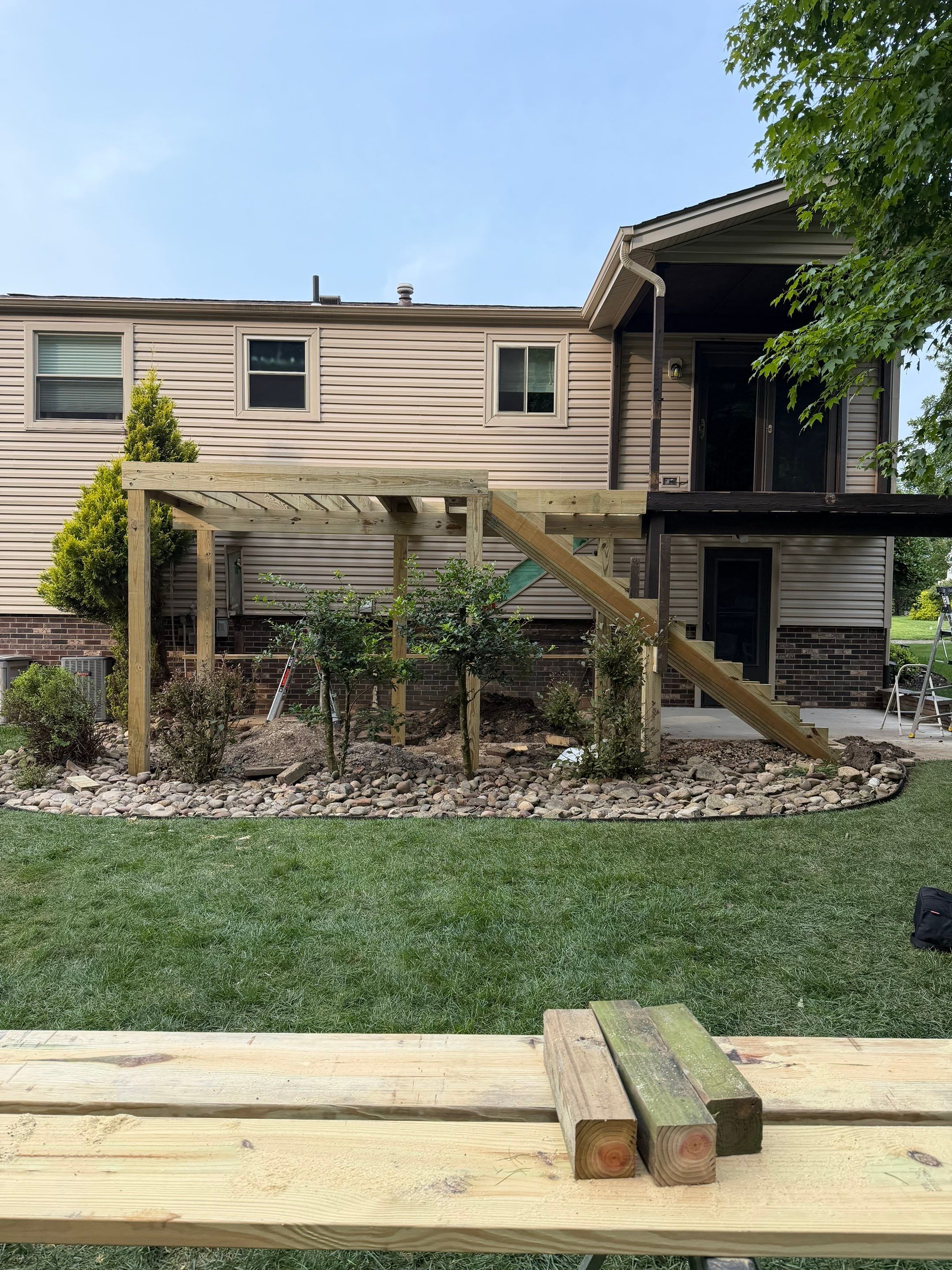 Elevated Composite Deck Installation with Covered Porch in South Park Township by Cousins Roofing Siding & Decks