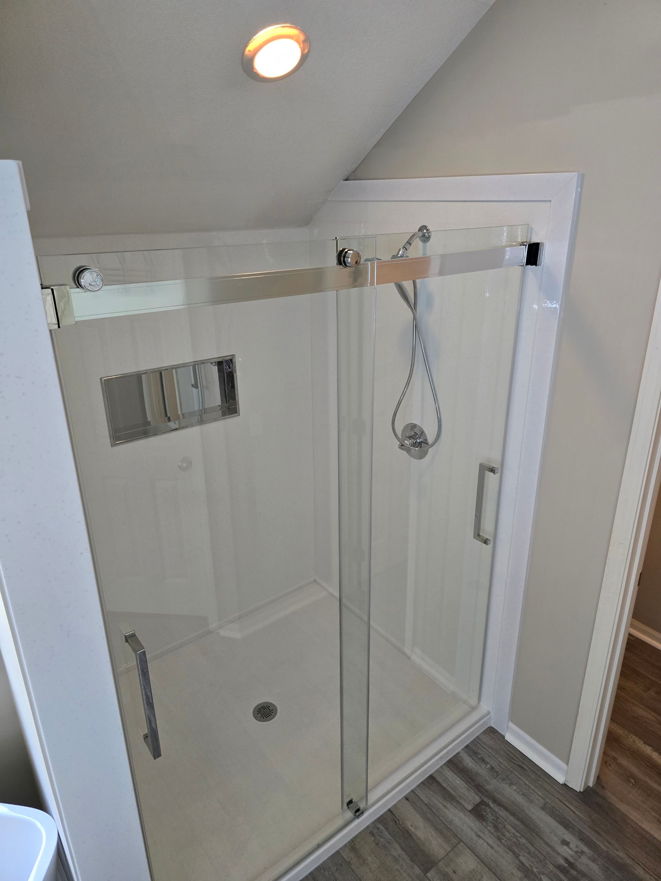 Full bathroom remodel with Artus lighted mirrors, Waltz bathtub and Mercury doors by The Shower Company