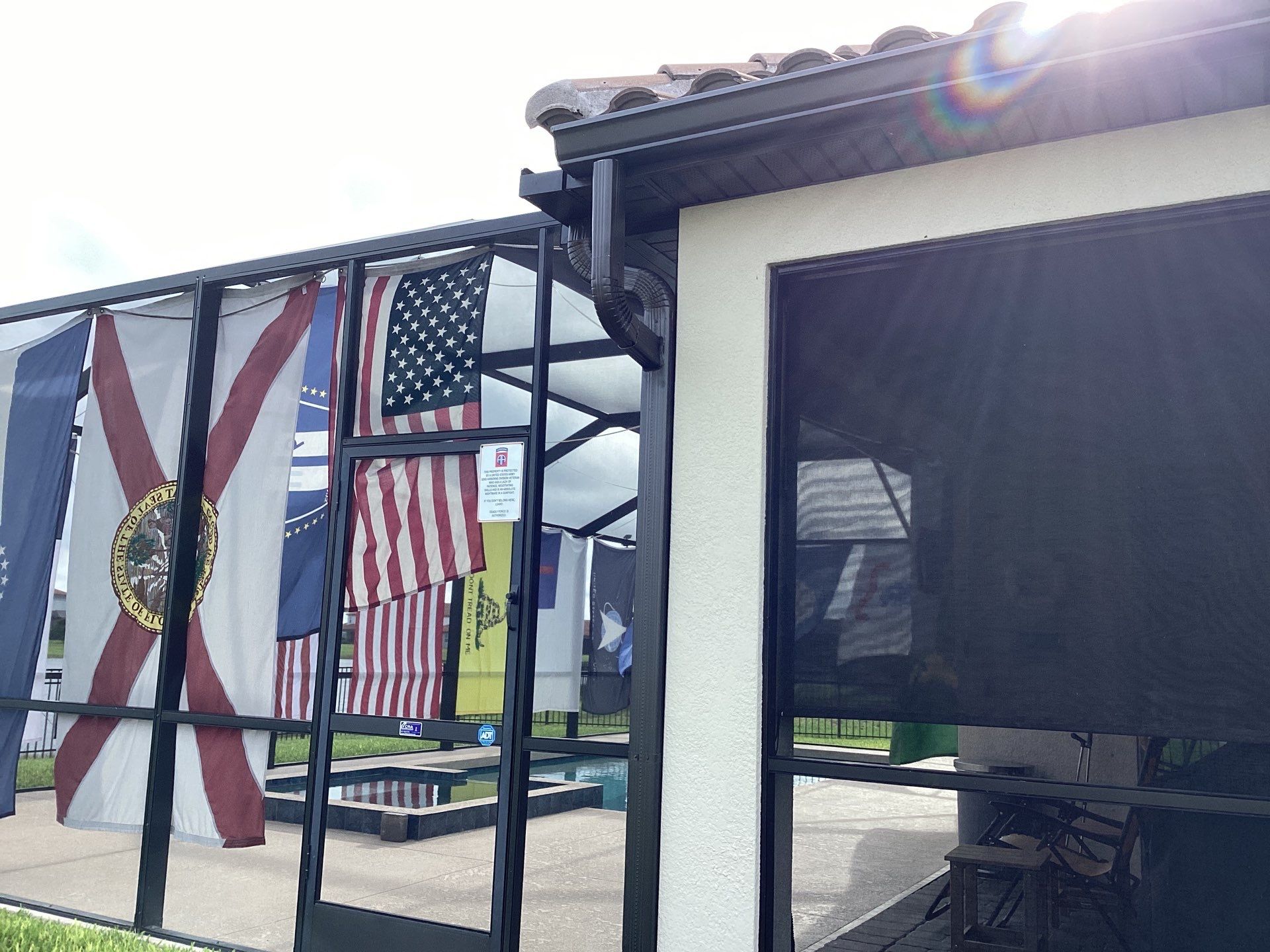 Musket brown seamless gutters with splash guards, new downspouts, and extensions in Bradenton, FL by Gutter Professors