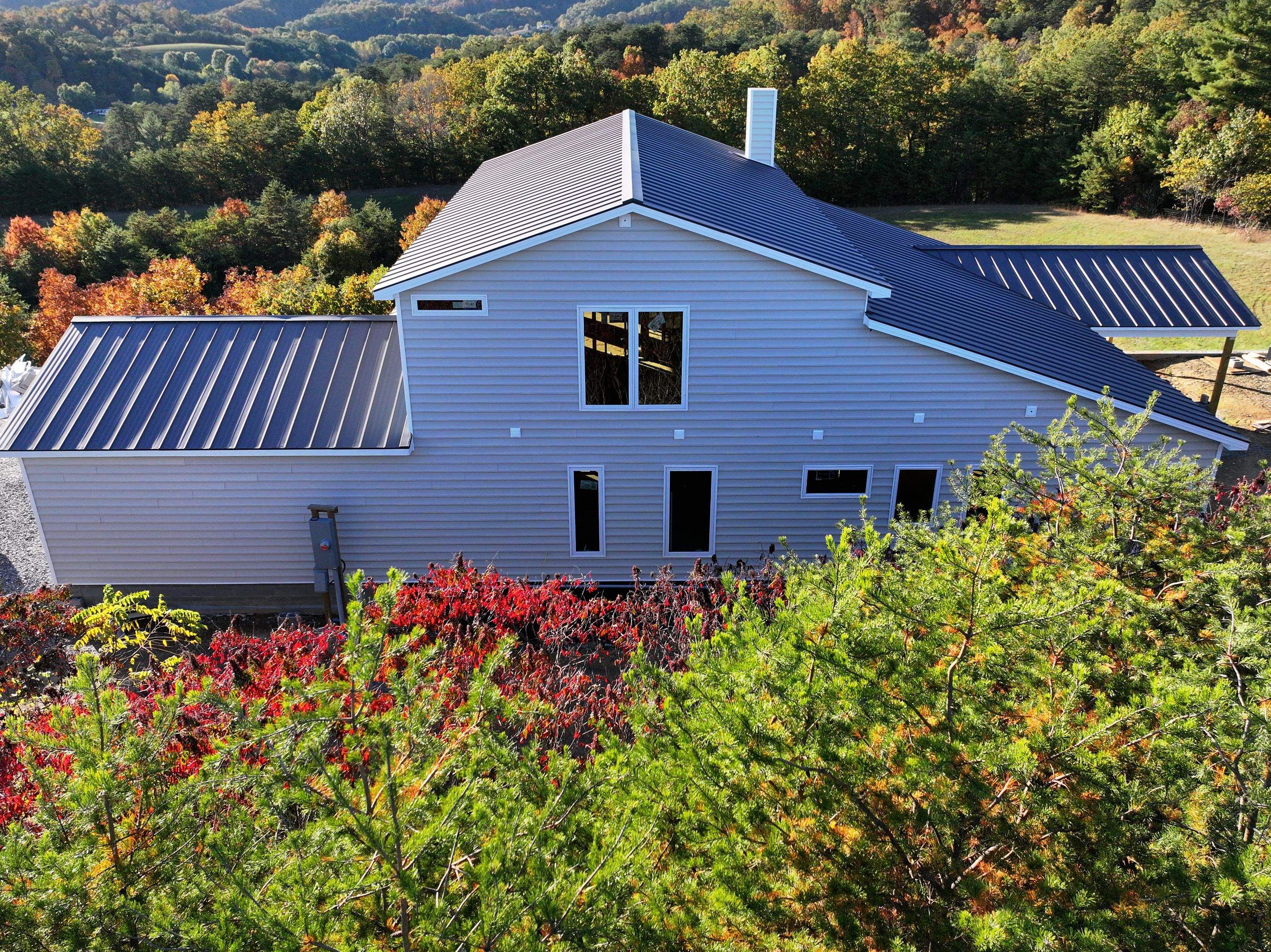 Textured Charcoal Gray Standing Seam by Omnia Roofing
