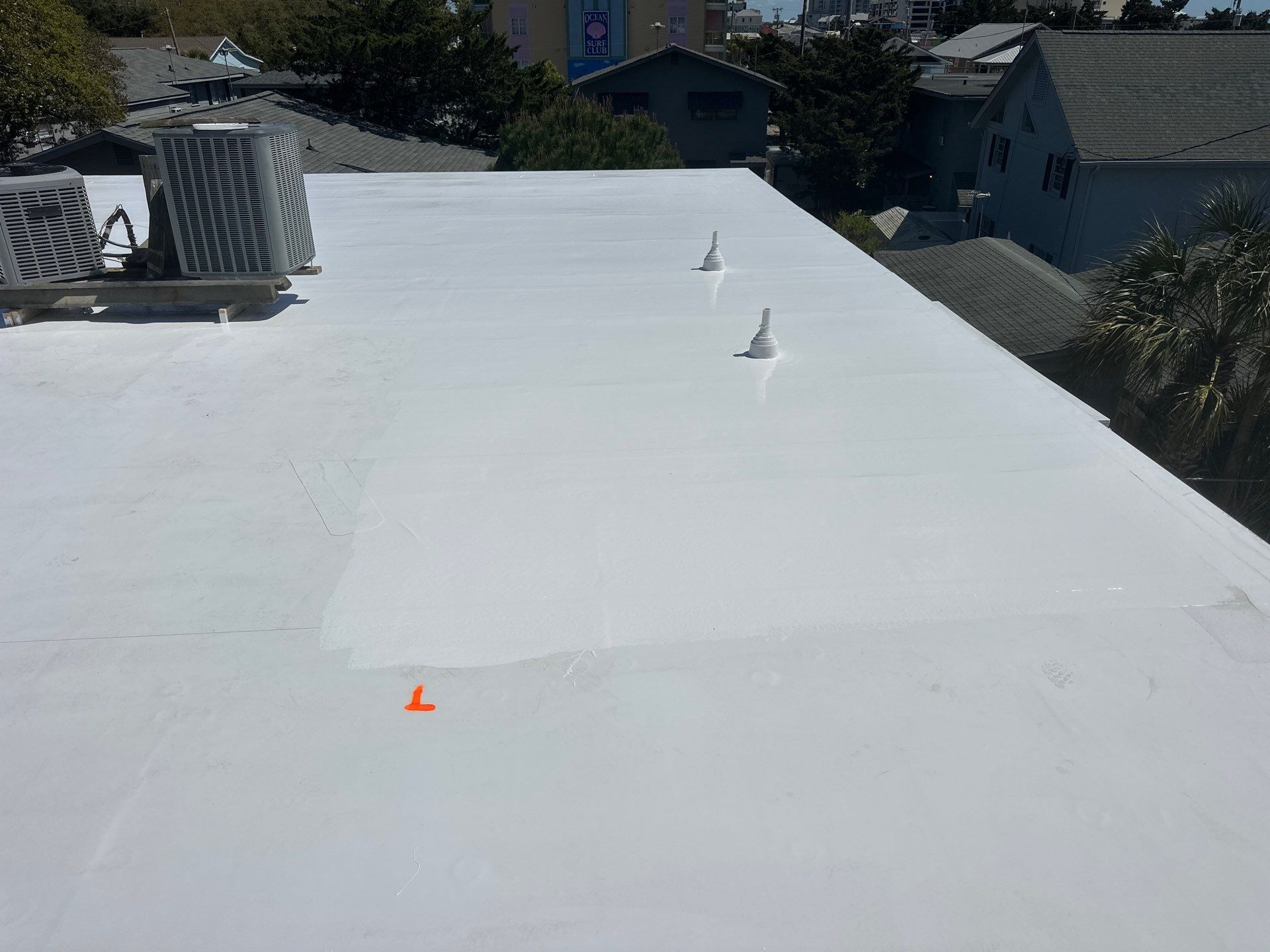Commercial Building Roof Coating using 924 Eterna-Sil Premium Silicone Roof Coating by RGR Construction and Roofing, LLC