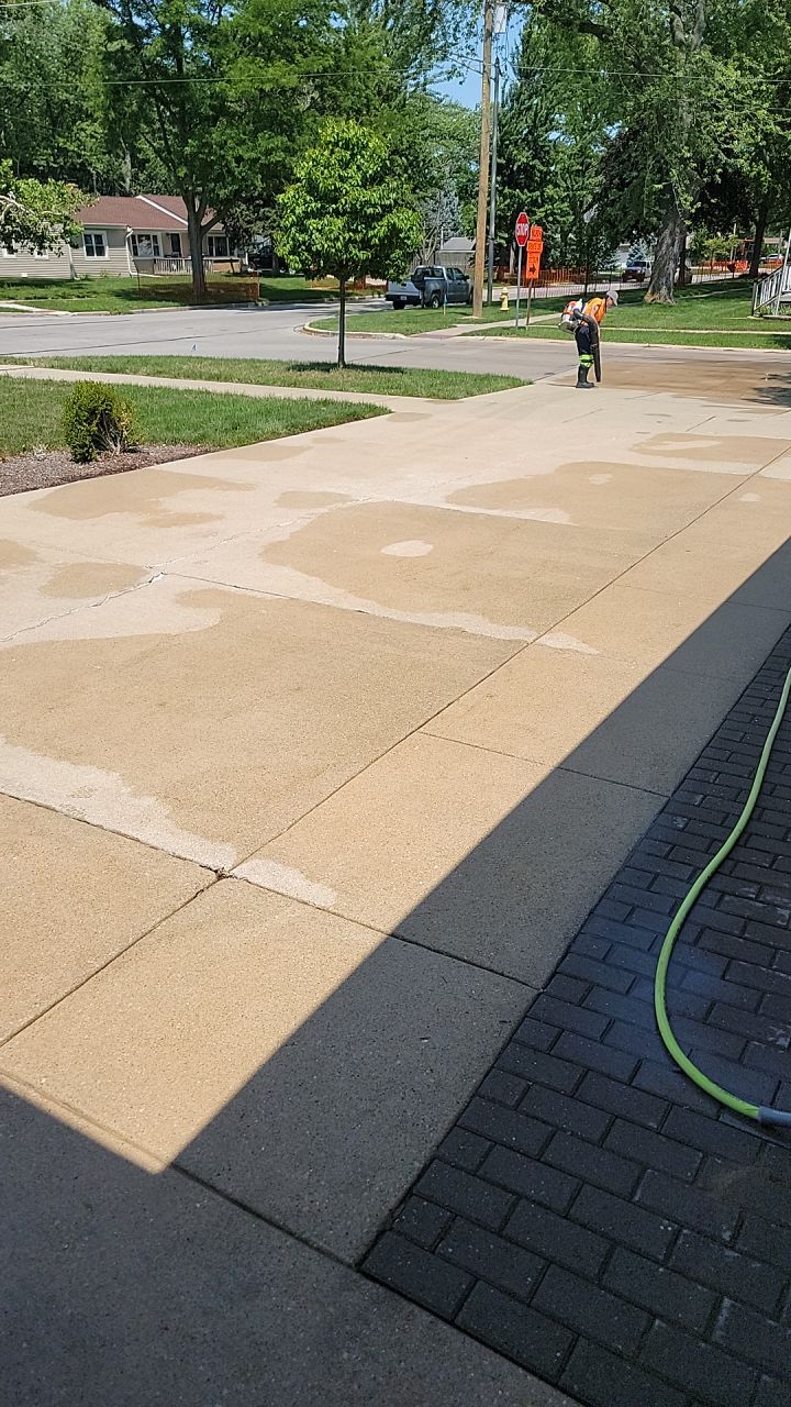 Oil extraction from concrete driveway.  by Northern Power Washing LLC.