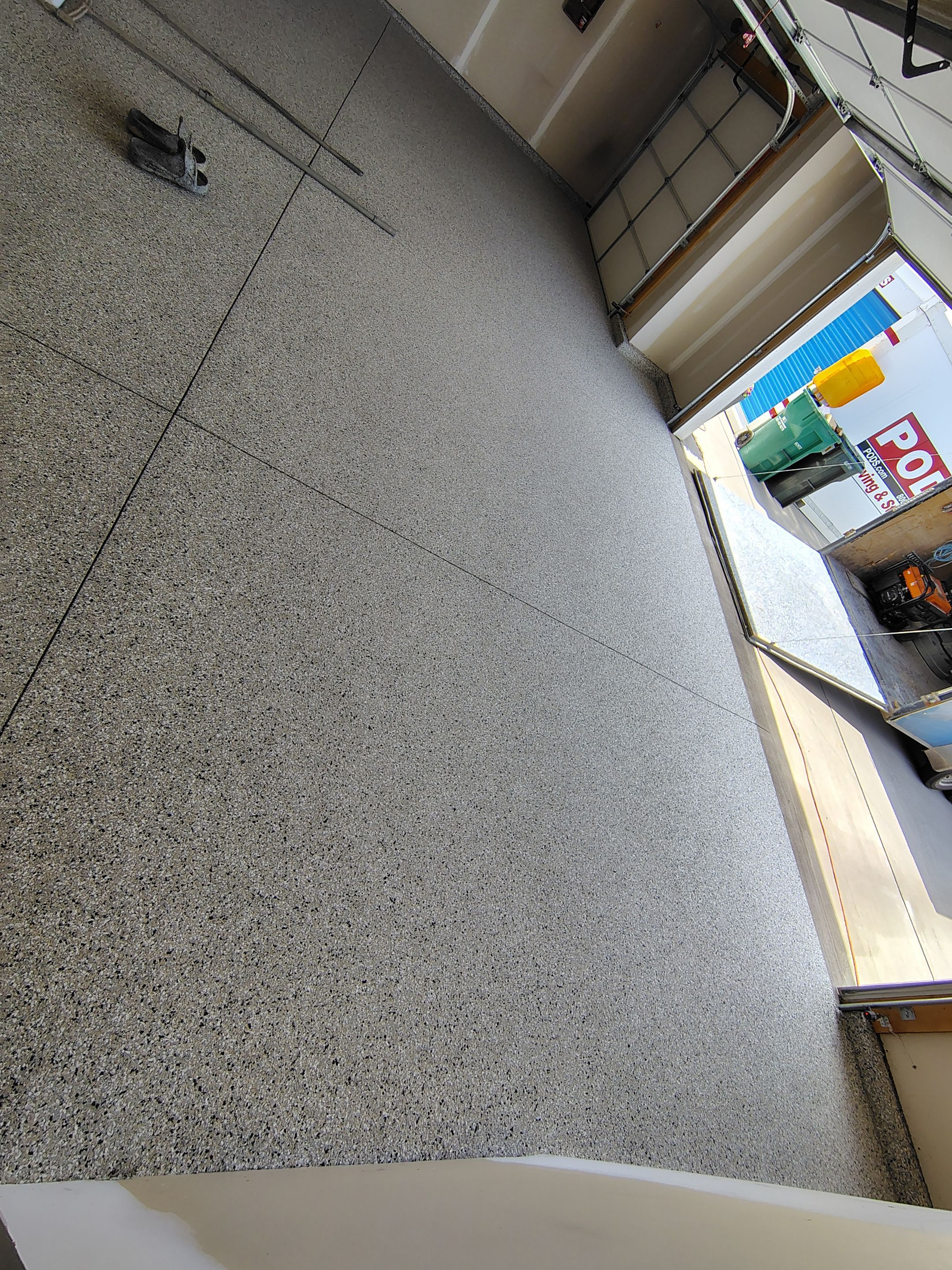 Epoxy Garage Floor Coating with Decorative Flake in Harrisburg by Select Painting, Coatings & Garage Cabinets