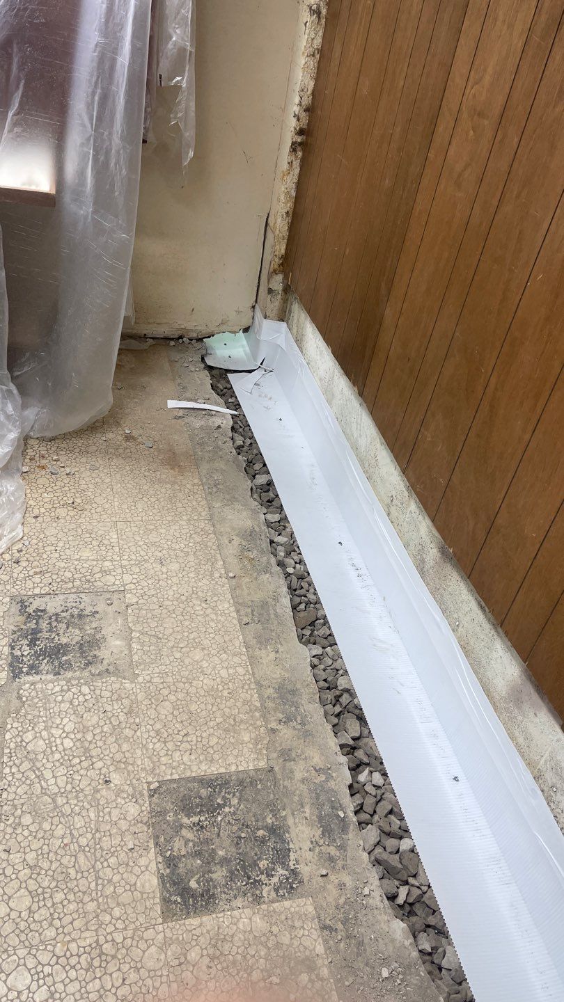 Interior Waterproofing Using GrateDrain™ Products by Toledo Basement Repair 