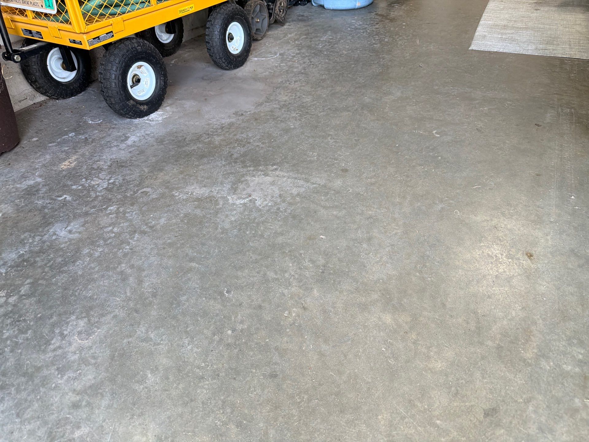 Residential Garage Floor Coating with Feather Grey Finish in Sioux Falls by Select Painting, Coatings & Garage Cabinets