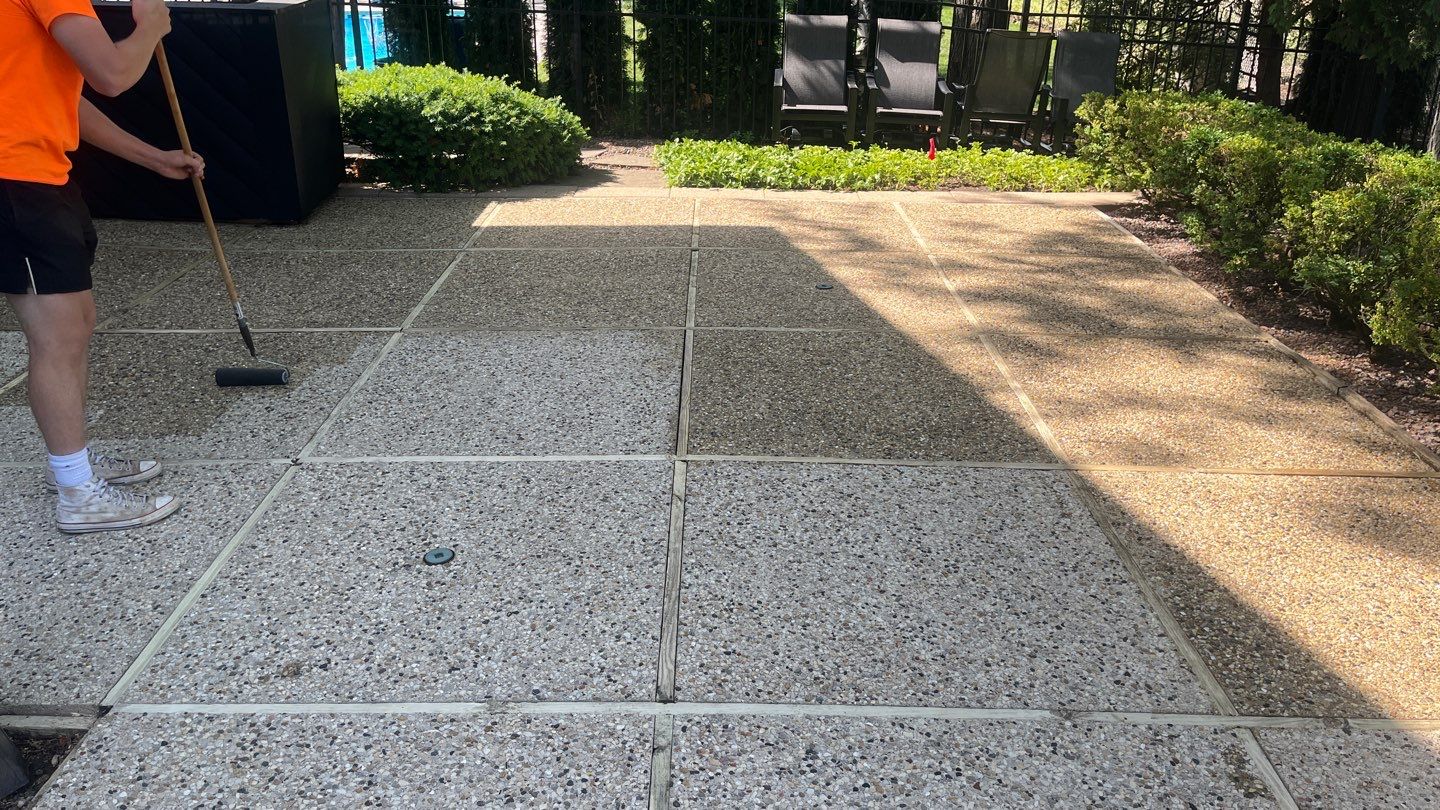 Aggregate concrete cleaning and sealing using Surebond SB-9000 by Northern Power Washing LLC.