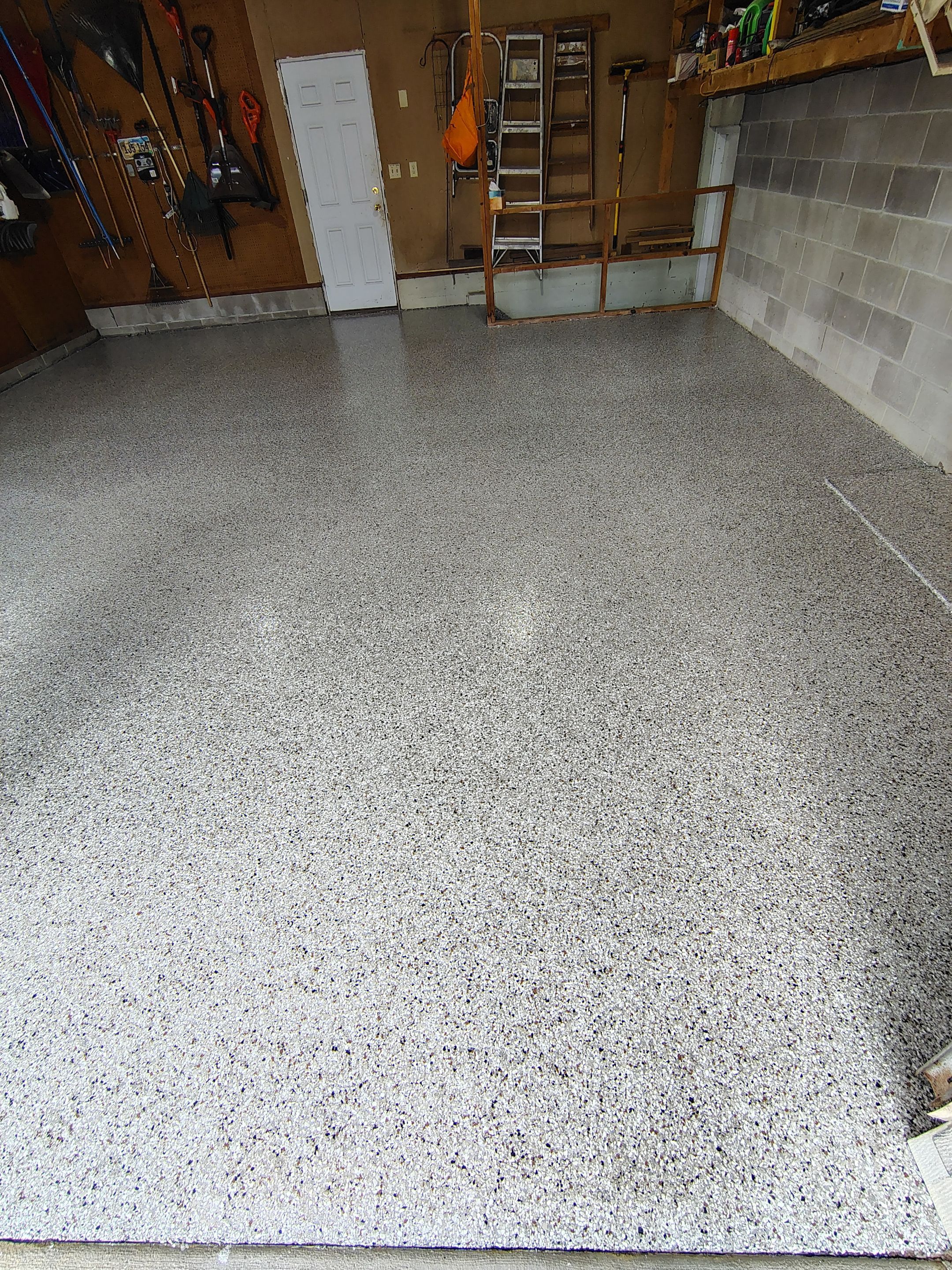 Sioux Falls Garage Epoxy Floor Installation and Concrete Crack Repair by Select Painting, Coatings & Garage Cabinets