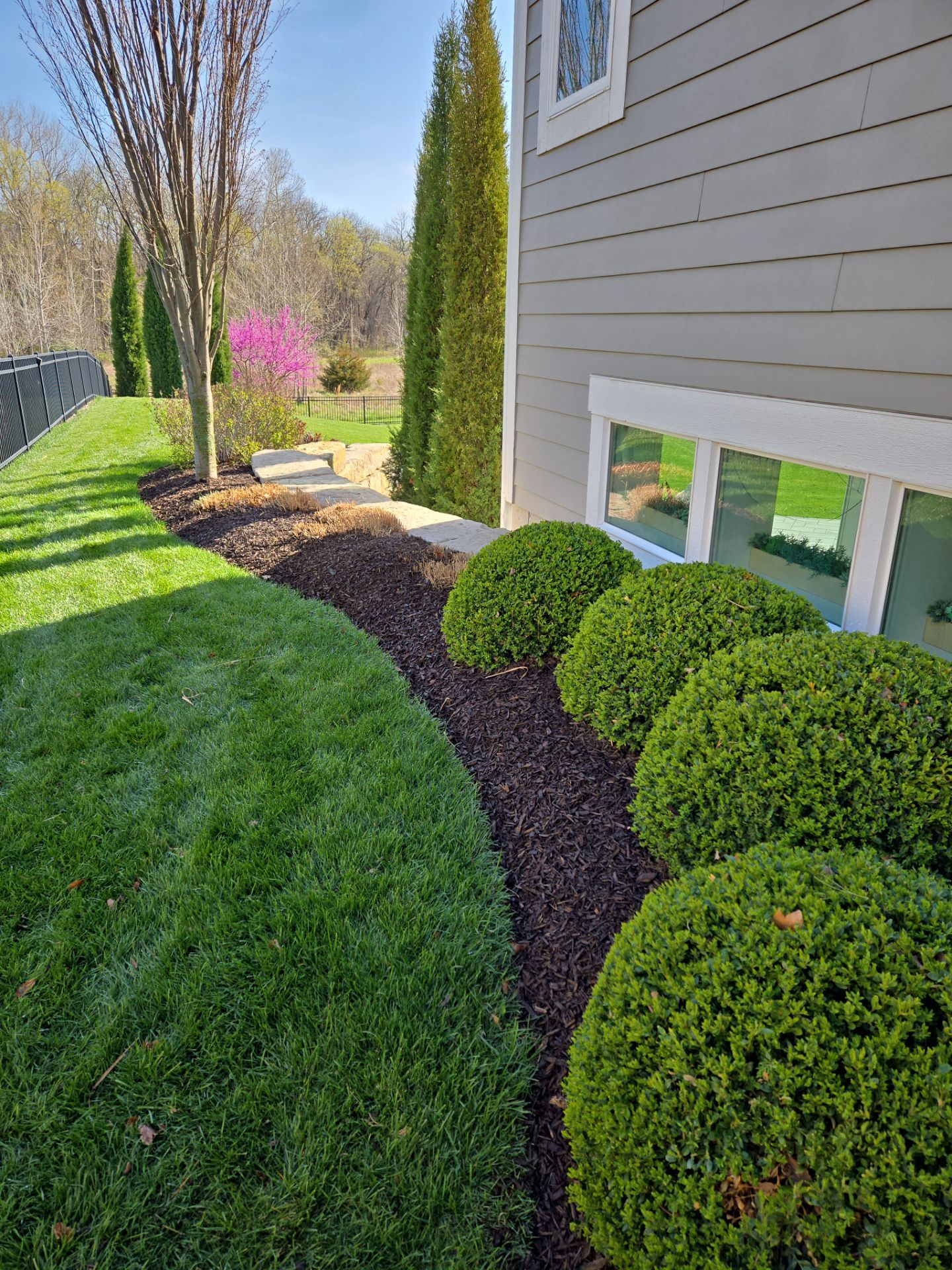 Front Yard Landscape and Walkway Renovation in Overland Park by LAND ESCAPES LLC