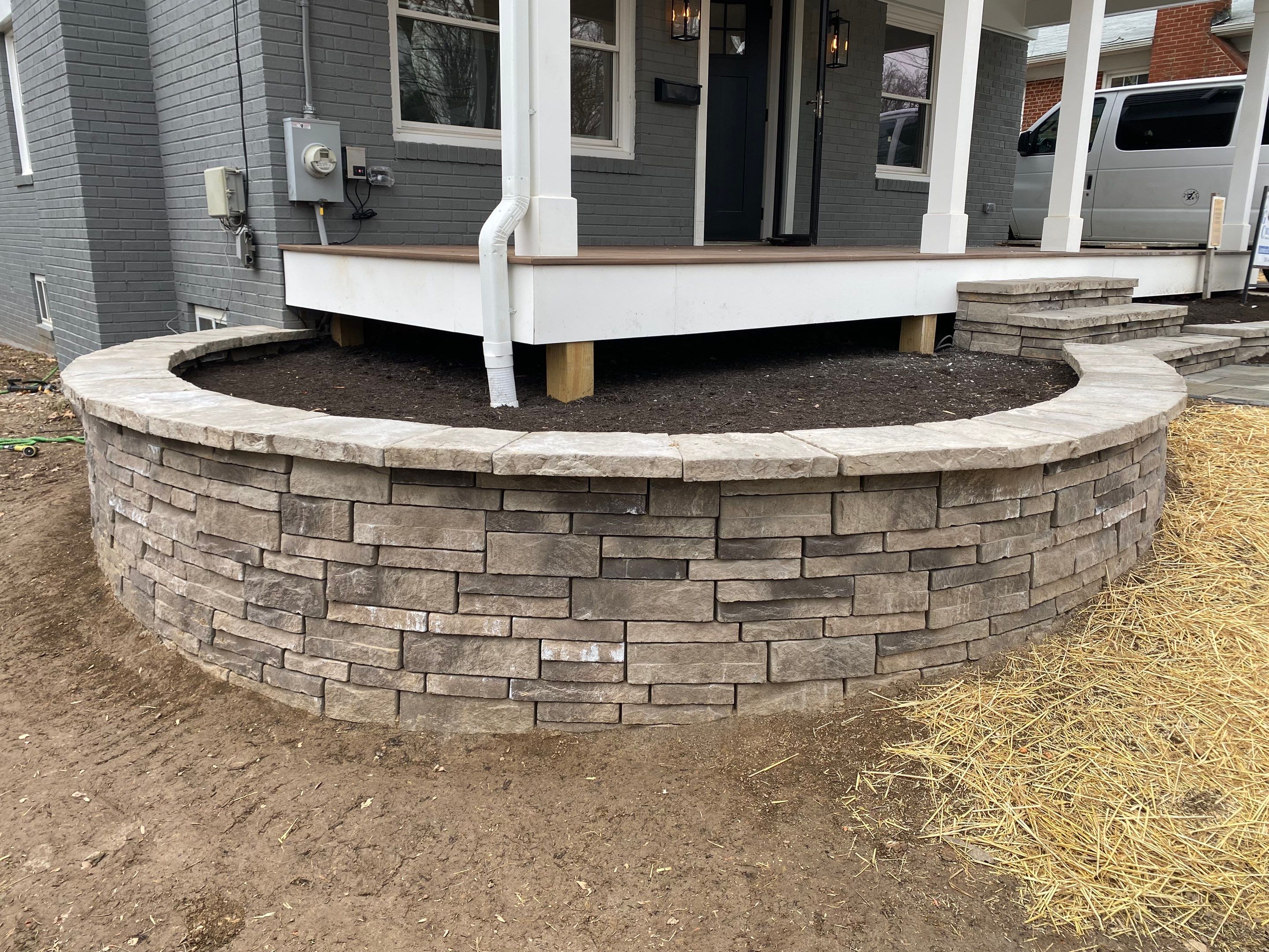 Retaining wall, walkway, small patio and landscape install by The Smet Companies, LLC