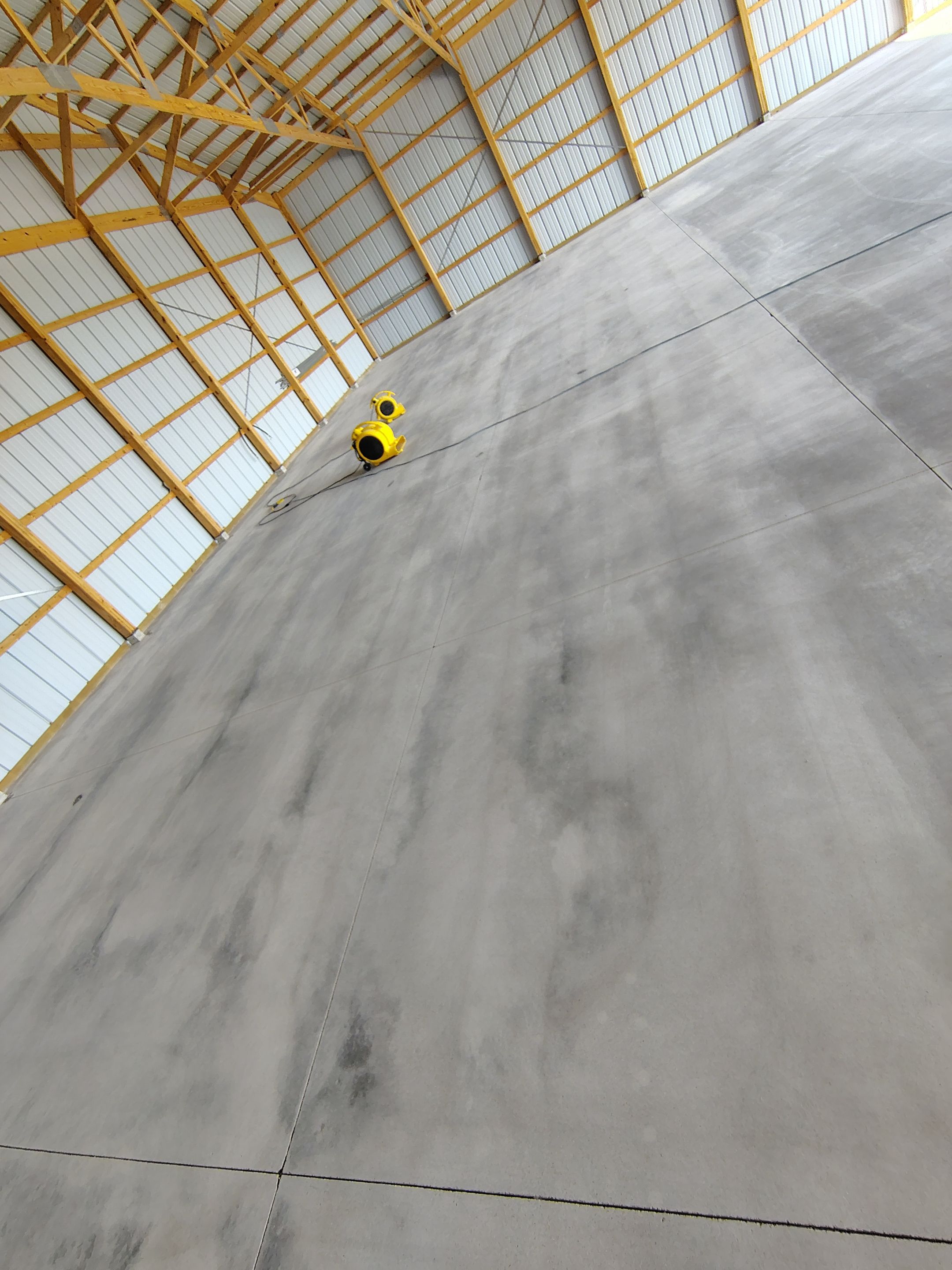 Durable Grey Speckled Epoxy Floor Coating for Yankton Shop by Select Painting, Coatings & Garage Cabinets