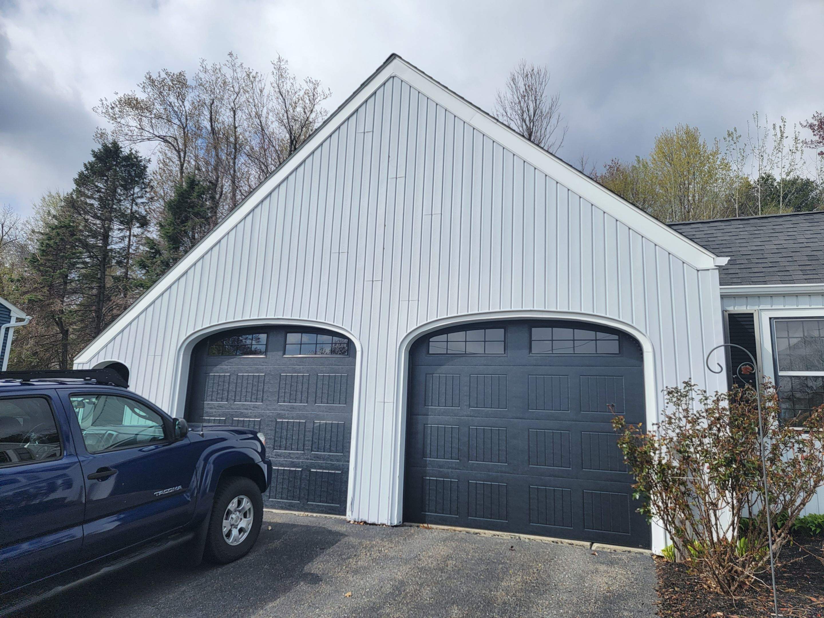 Siding Installation using James Hardie Countrylane red by UBrothers Construction