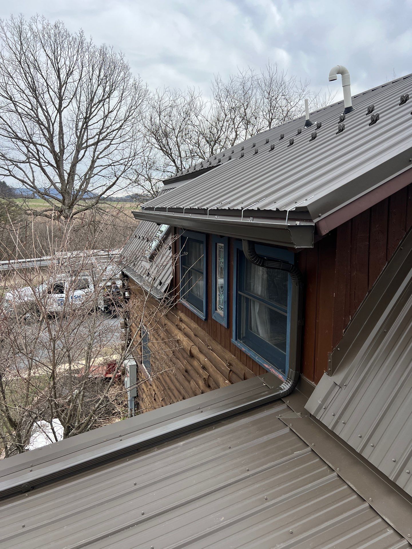 Textured Bronze ABM Metal Roof and Skylight Installation in Halifax by Esh Builders