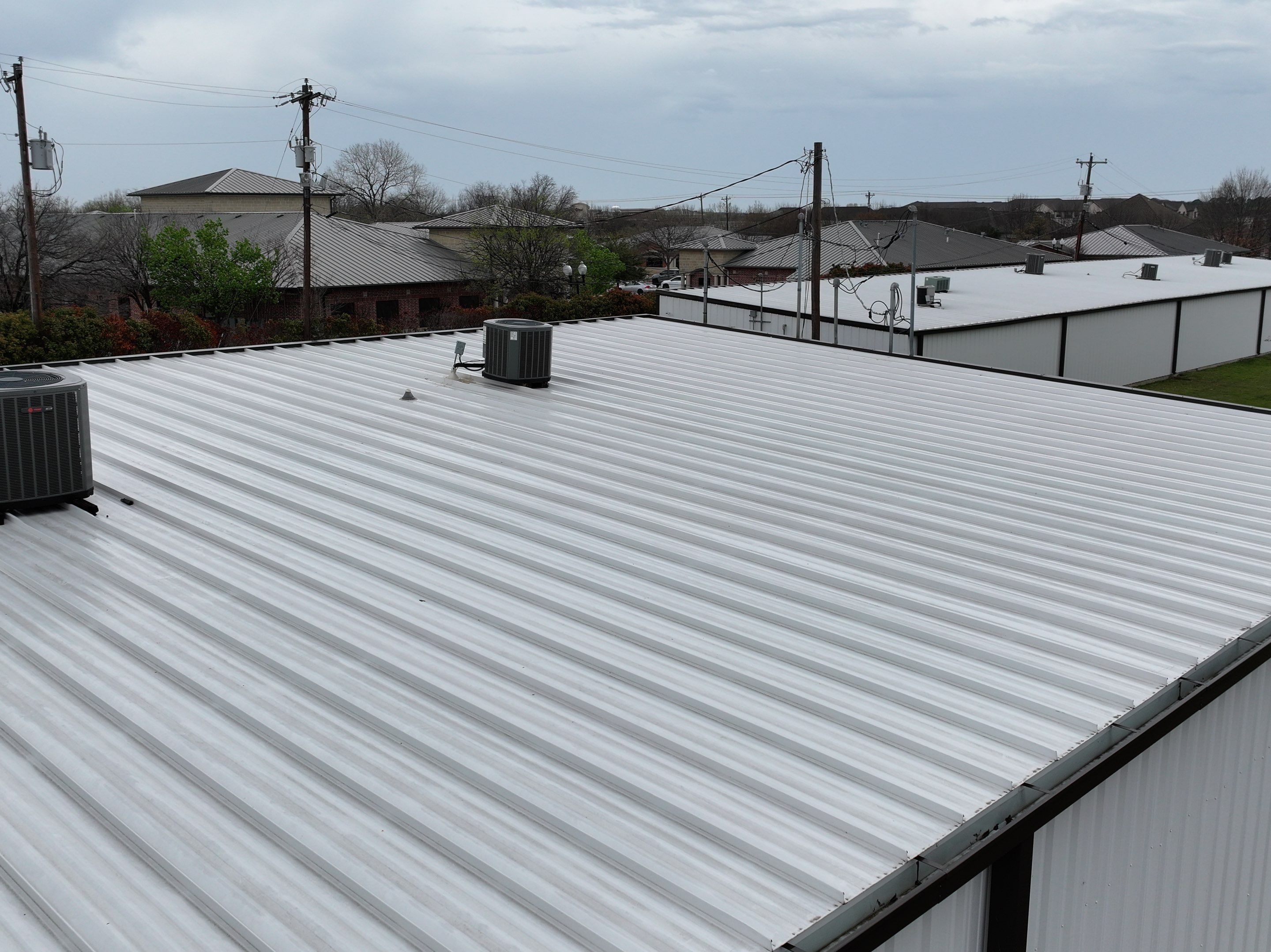 Commercial Roofing Installation using Double lock Mechanical Standing Seam Metal by Becker Roofing and Exteriors