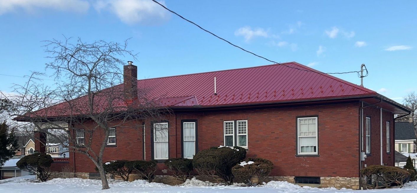 Red Metal Roofing Upgrade for Brick Home by Esh Builders