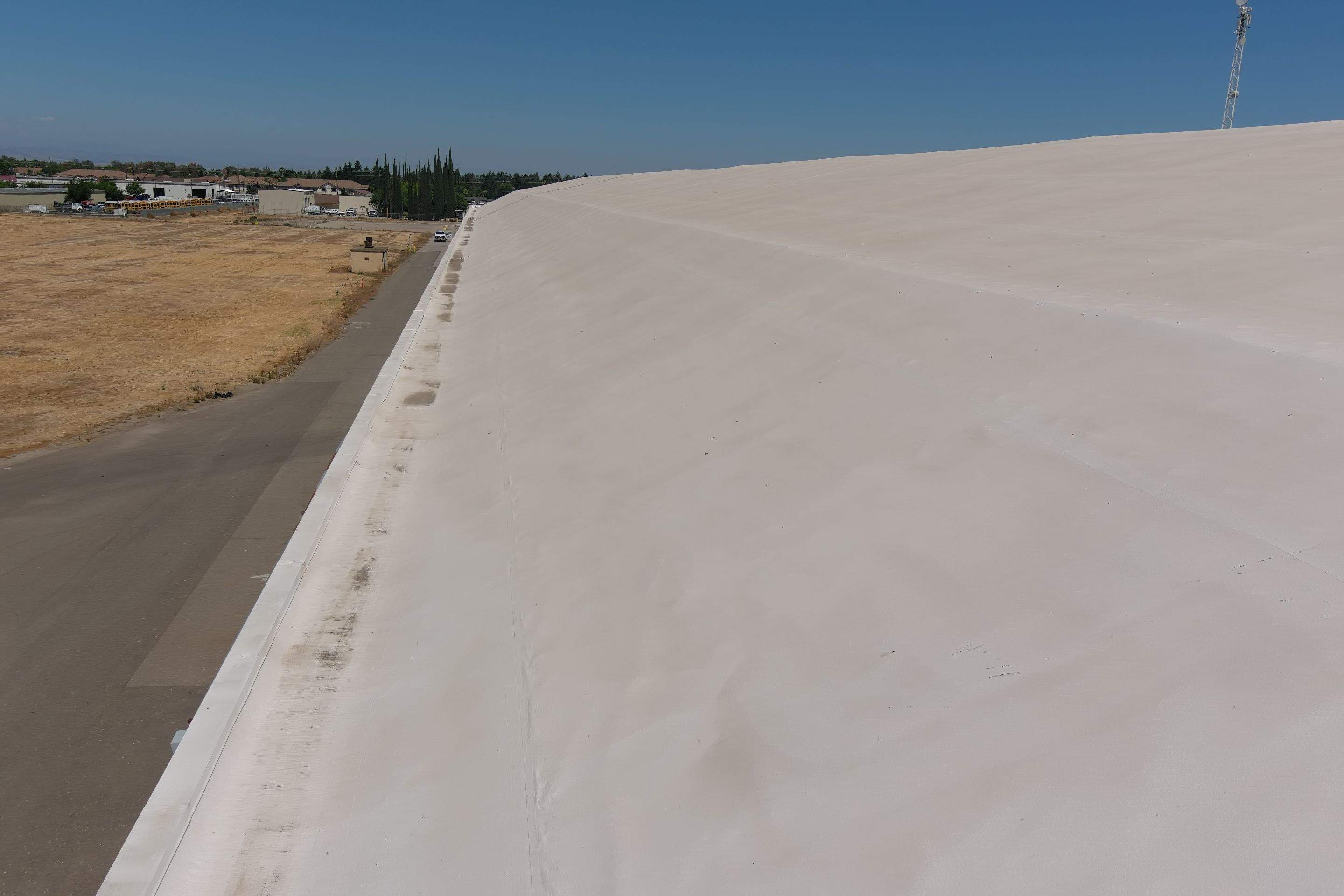 Single-ply restoration system using Conklin Benchmark/PUMA XL fabric and coating by Straight Edge Roofing Inc