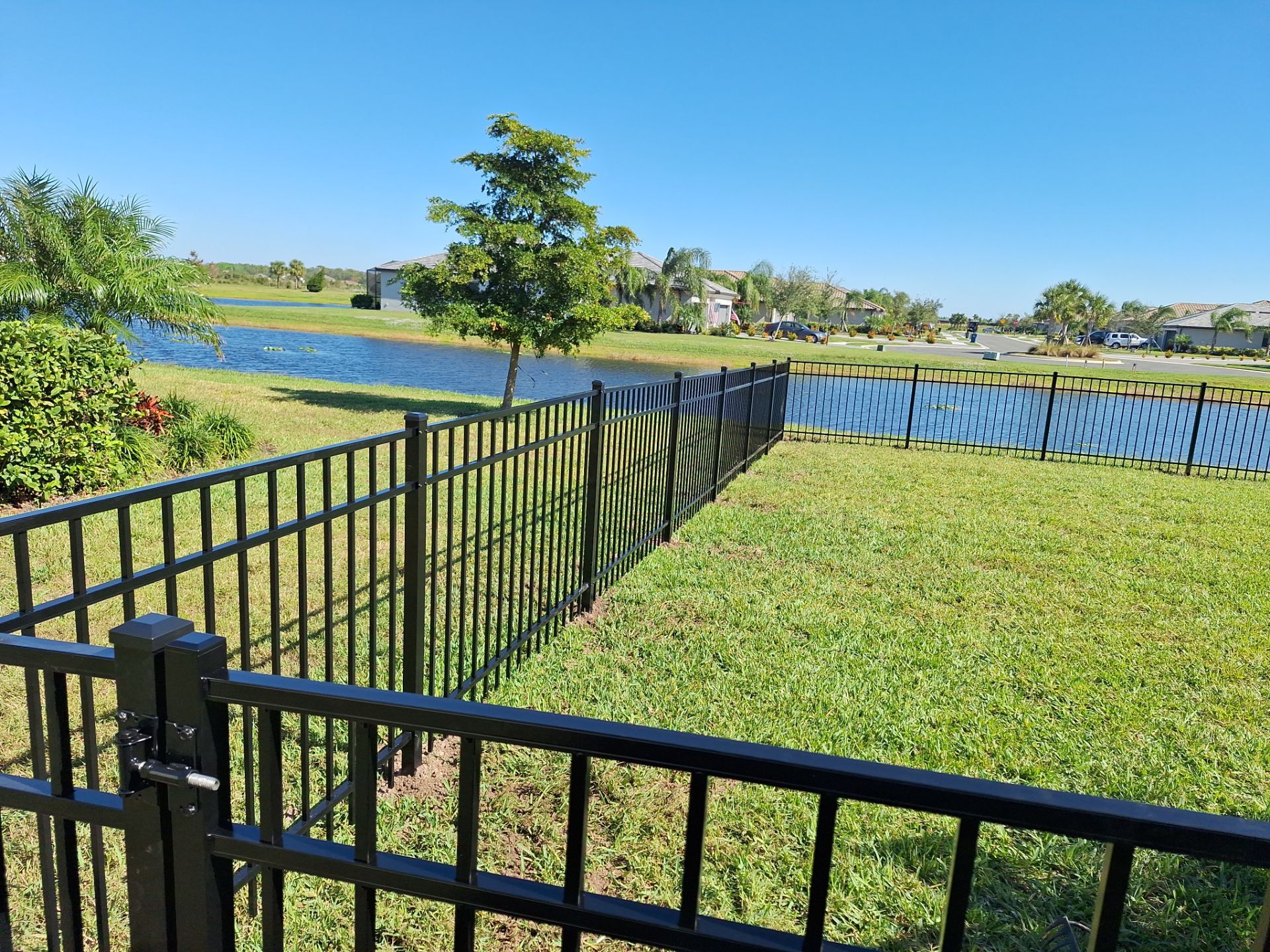 Aluminum Fence Installation using 4ft 3 Rail Black Aluminum Fence by Asap fence and gates, LLC