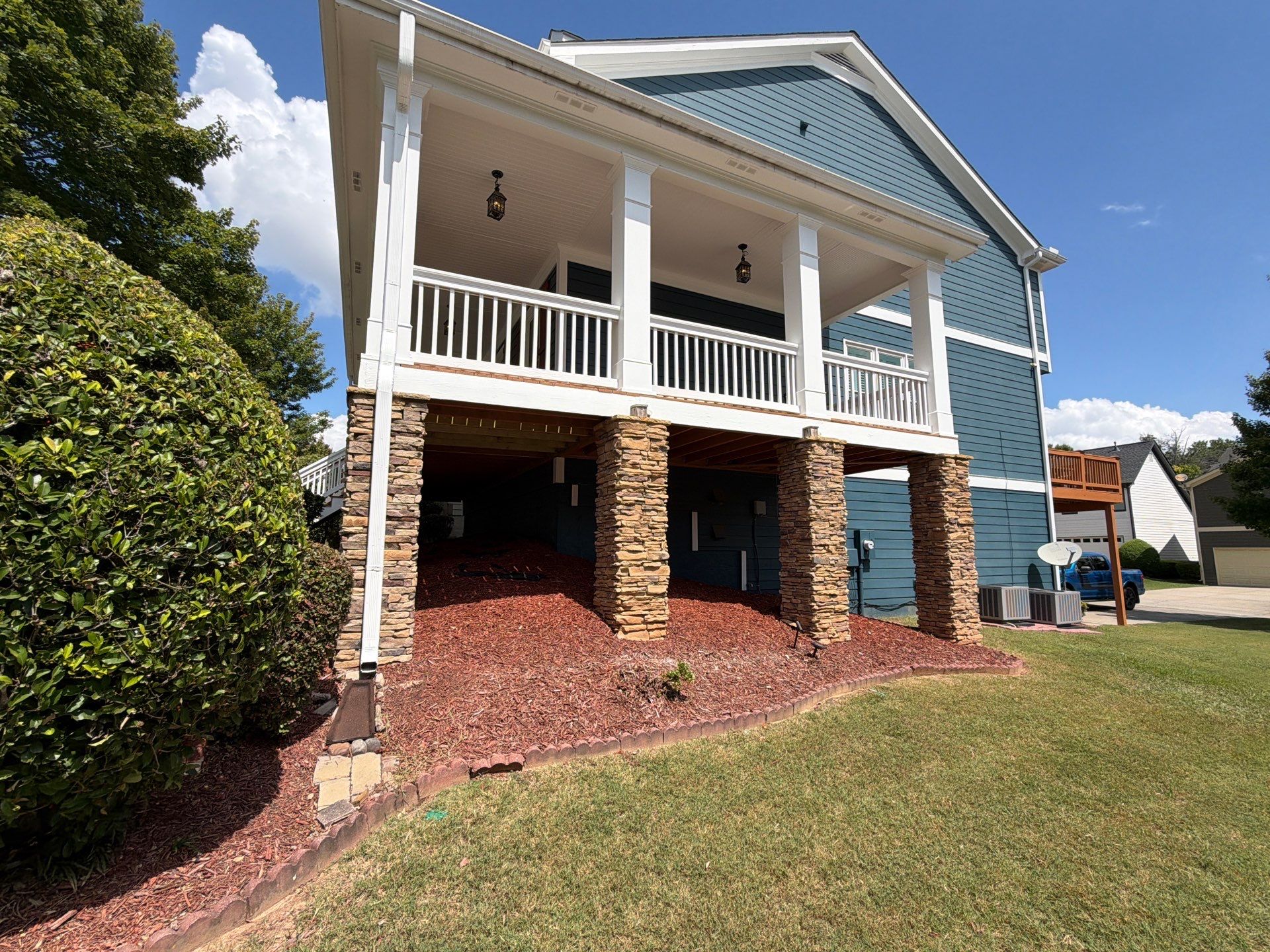 Atlanta Exterior Home Refresh with Blue Siding and Deck Staining by Swift Home Renovations 