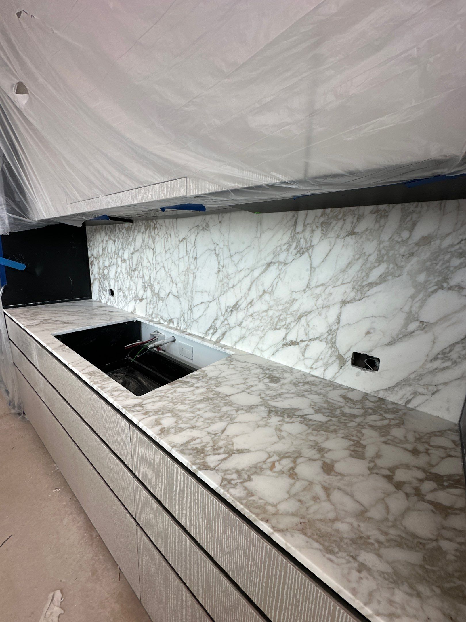 Kitchen Countertop with backsplash and Island top with mitered waterfalls by NC Stone And Tiles