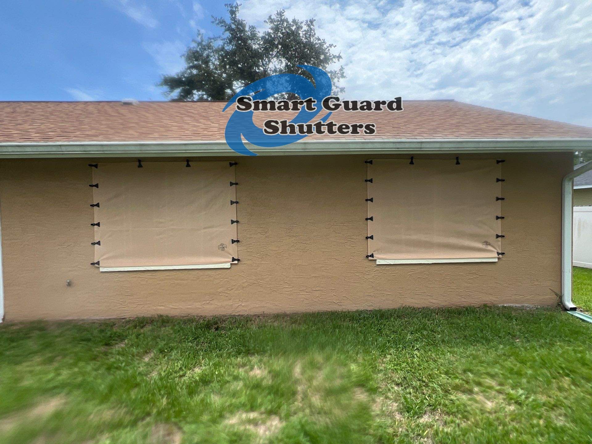 AstroGuard Hurricane Fabric in Tan by Smart Guard Shutters