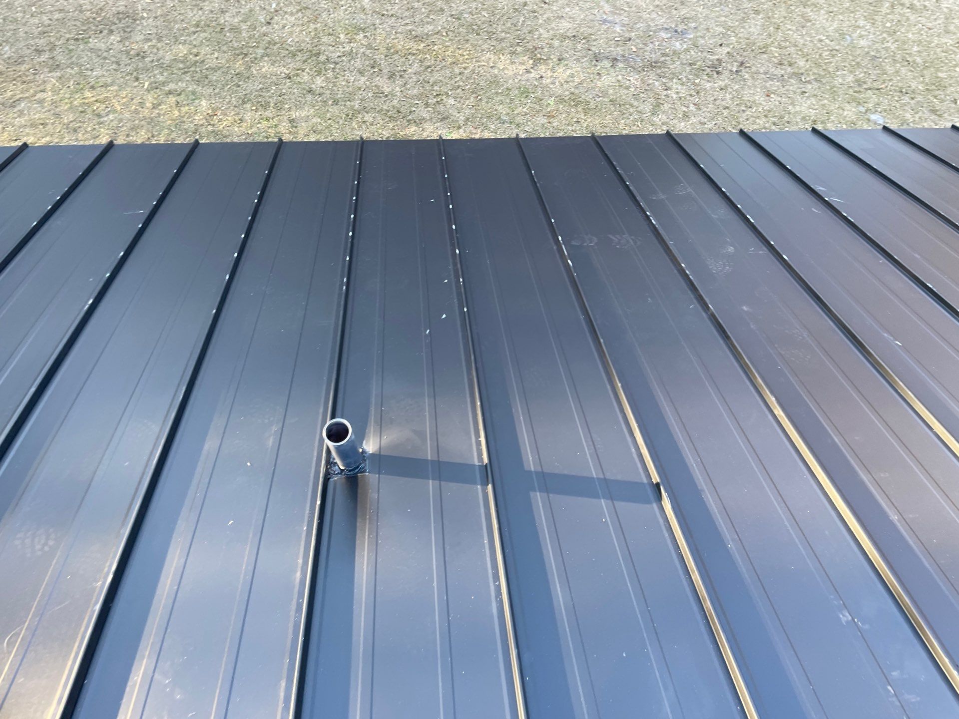 Residential Roofing Installation using Benton 26Ga 1inc Snapcock Metal Roof KYNAR Matte Black by Talya Roofing
