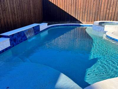 Freeform Pool with Rock Waterfall and Raised Spa