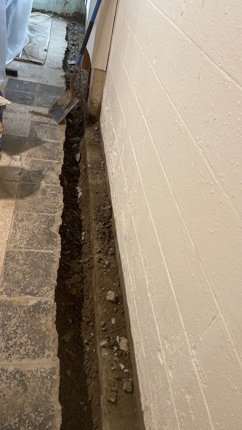 Interior Waterproofing Using GrateDrain™ Products by Toledo Basement Repair