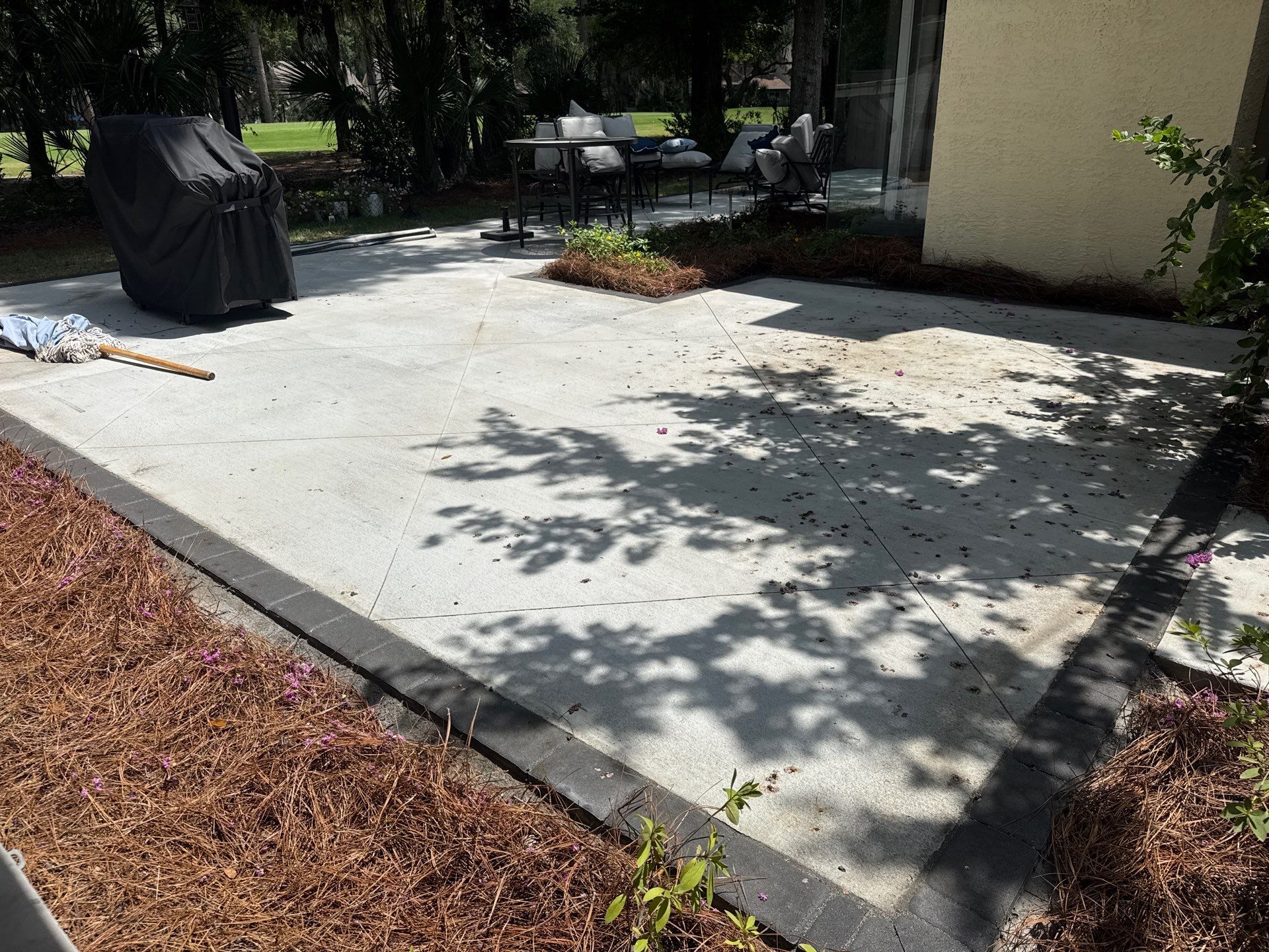 Custom Concrete Patio and Herringbone Paver Walkway in Hilton Head Island by Lowcountry Scapes, LLC