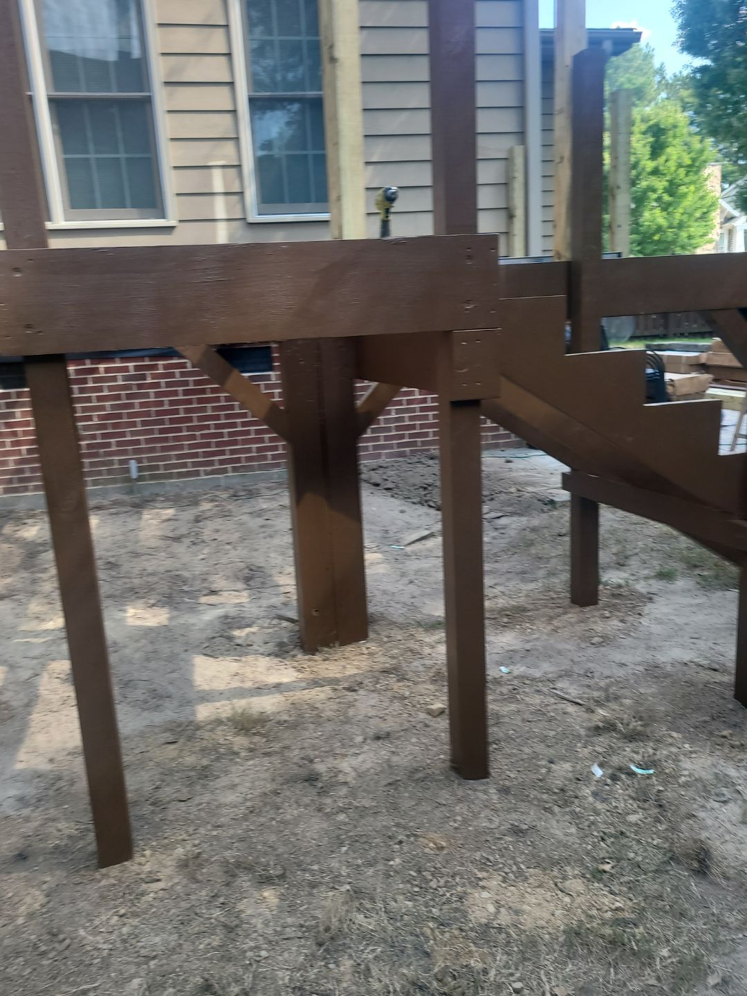 Fuquay-Varina Outdoor Upgrade – Composite Deck & Paved Landing by Elite Remodeling and Design LLC