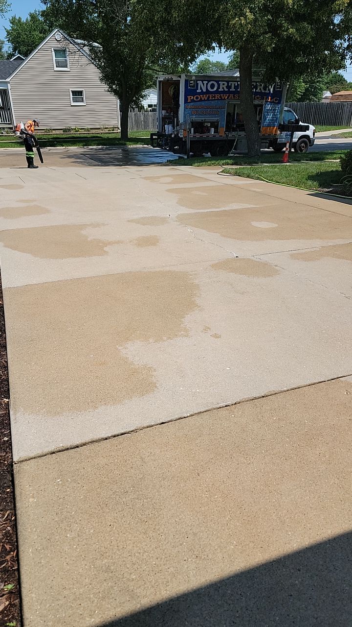 Oil extraction from concrete driveway.  by Northern Power Washing LLC.