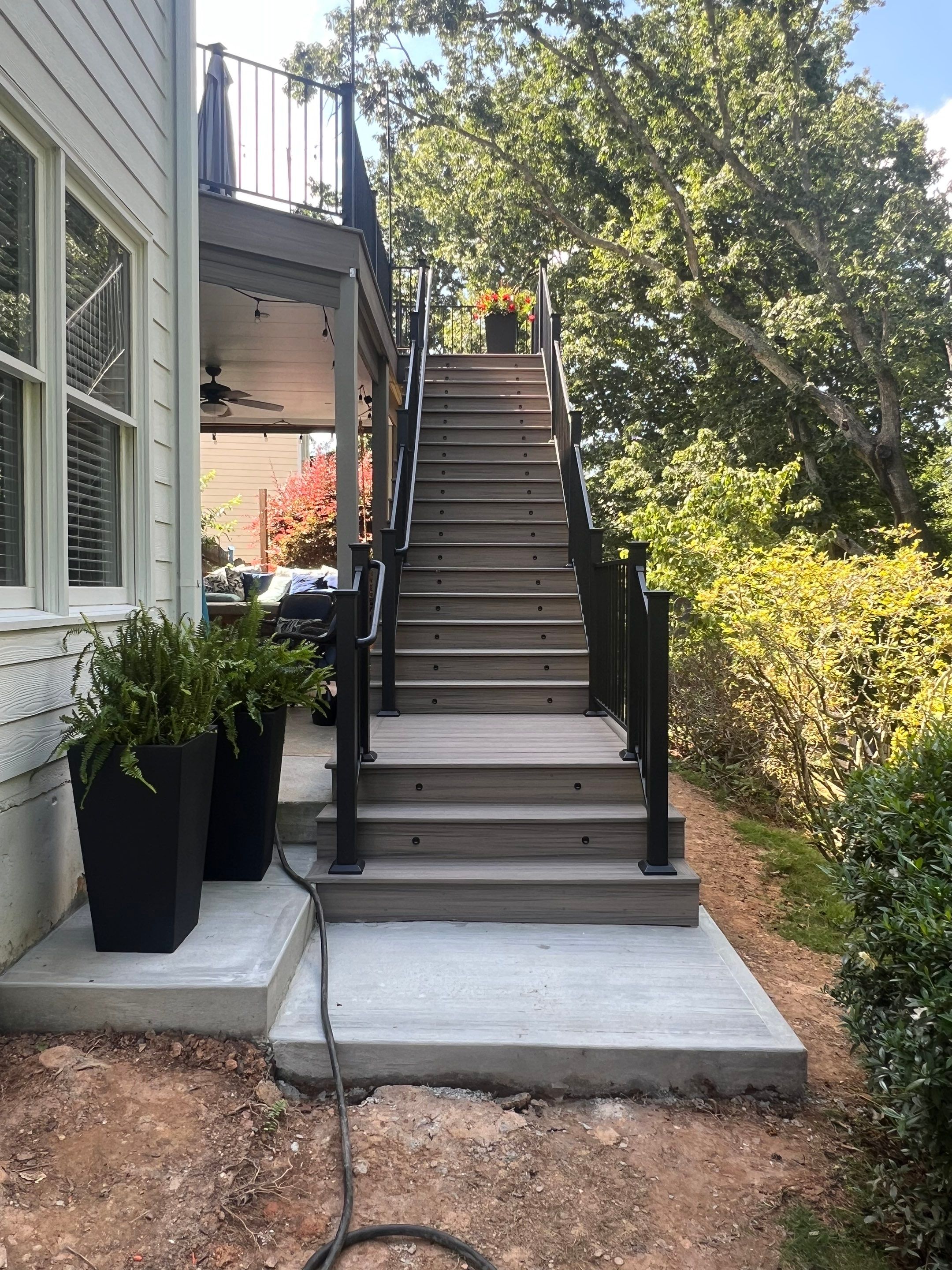 Elevated Composite Deck and Concrete Landing Installation in Kennesaw by Swift Home Renovations