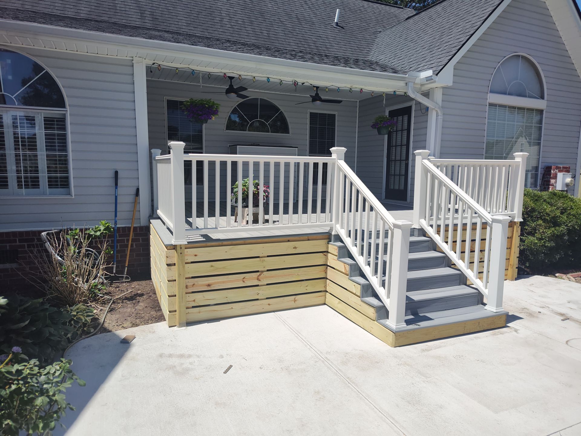 Outside porch and concreate work by Cornerstone Home Builders, LLC