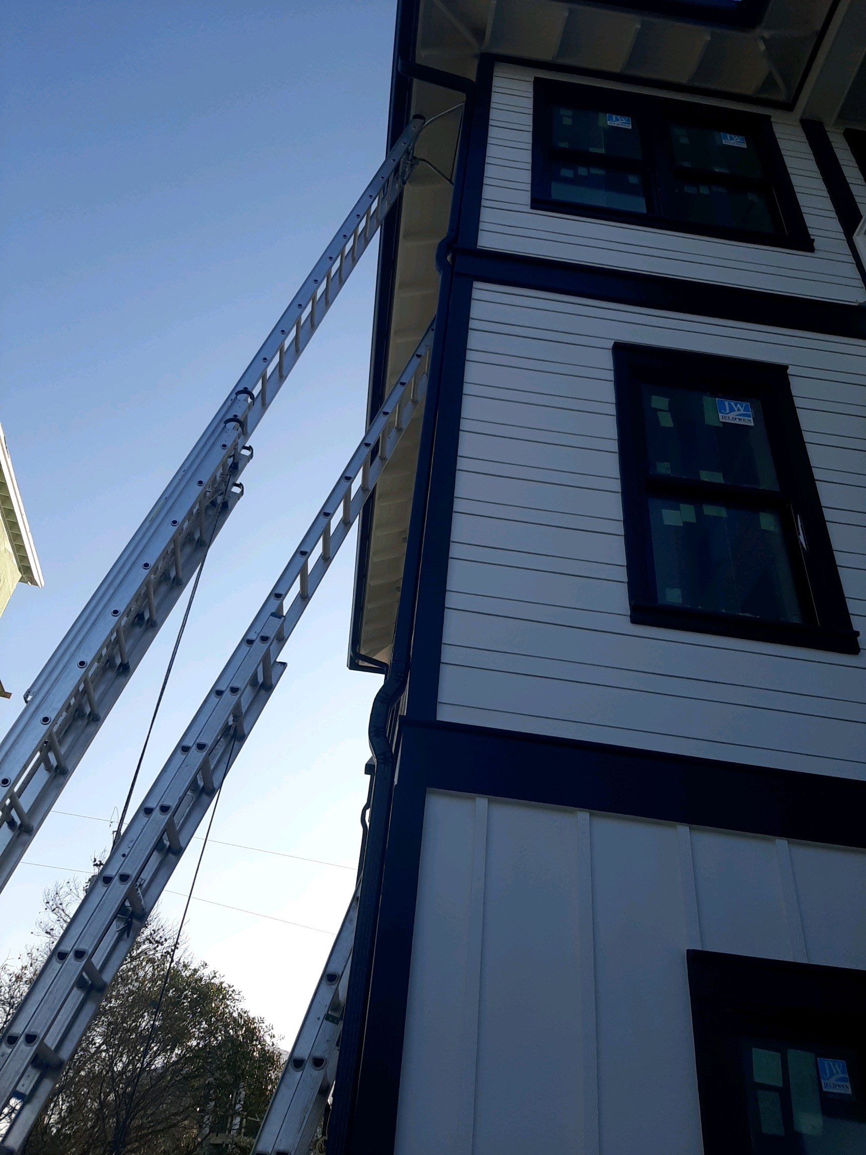 Seamless Gutter Installation Using Black Half Round Seamless Gutters by Gutter Professors