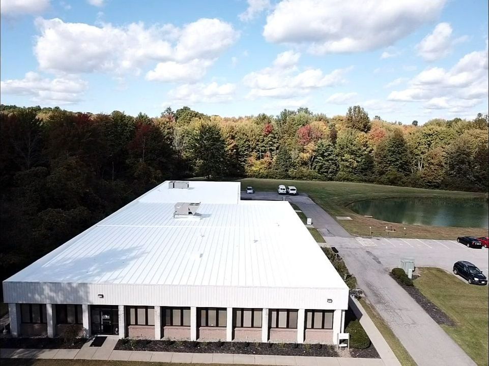 Commercial Metal Roof Coating by Gold Star Roofing LLC