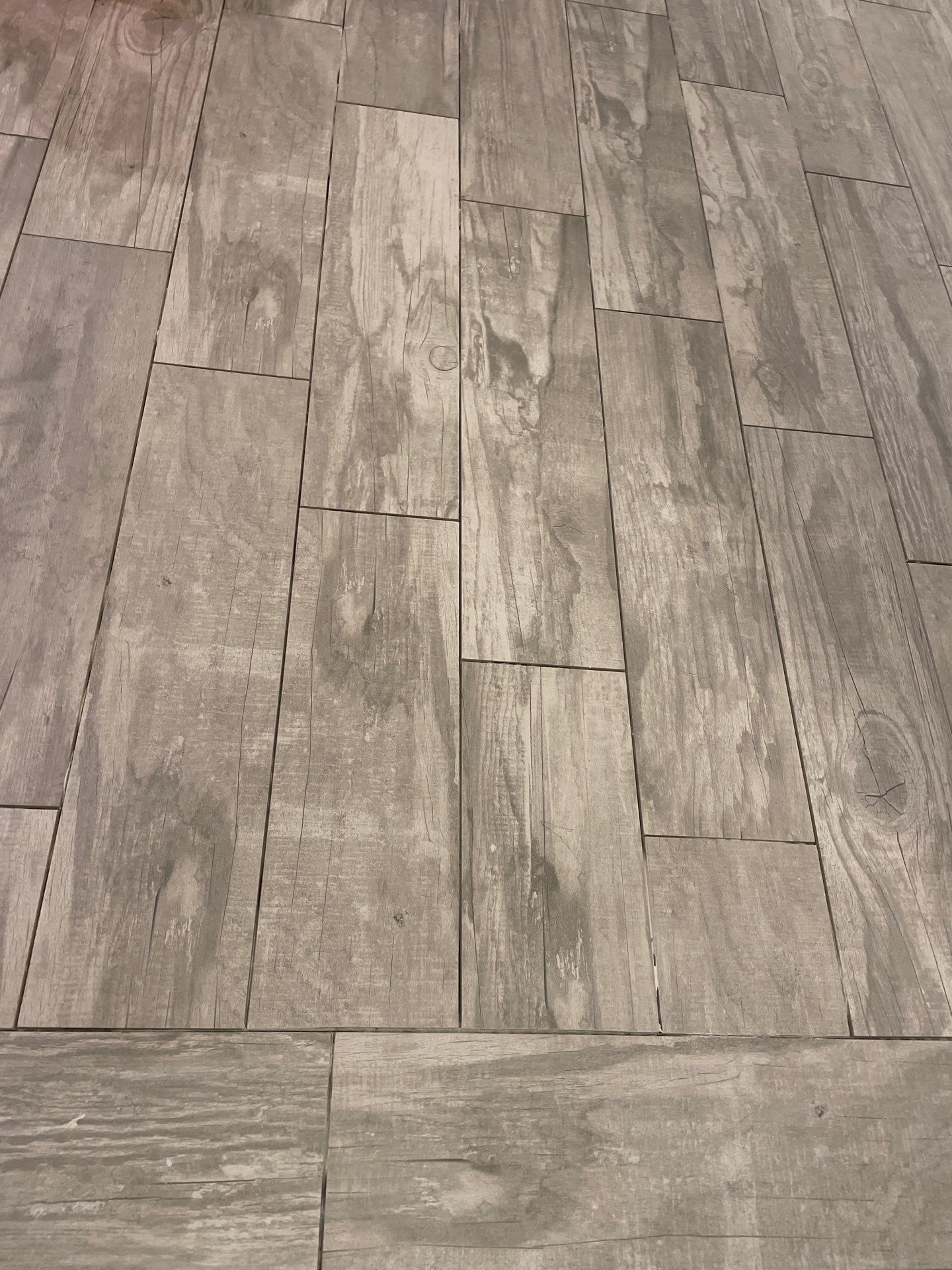 Herringbone and plank tile by Footprints Floors of East Atlanta