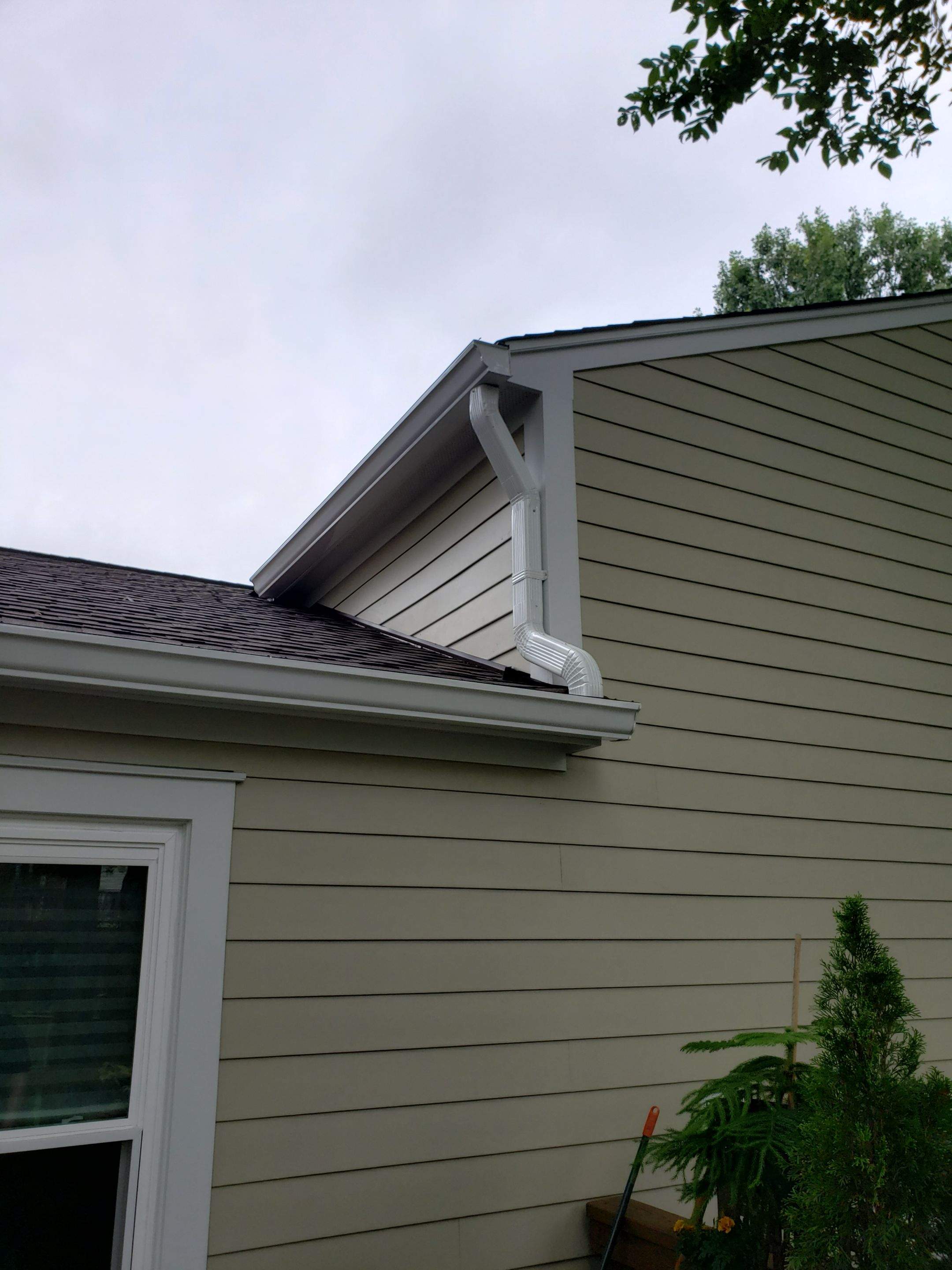 New composite windows and fiber cement siding with trim and gutters by Window Depot of Annapolis