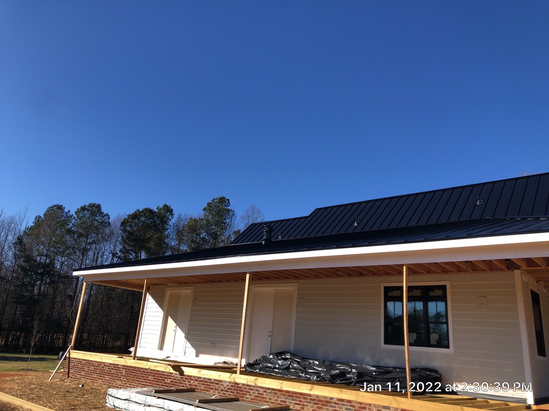 Custom Home Metal Roof Installation by Just In Time Roofing and Restoration